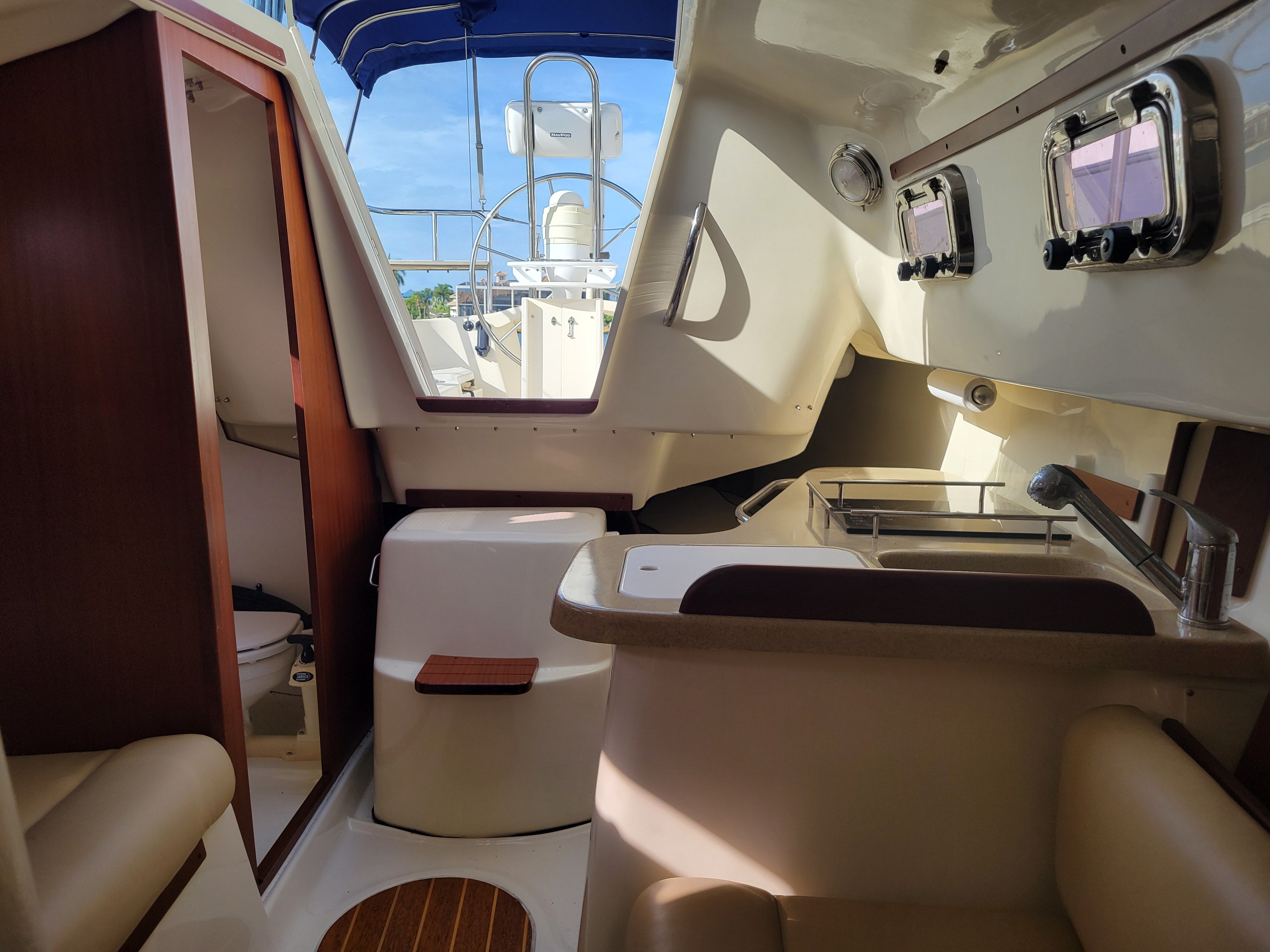Interior of a 2018 Hake Seaward 26 RK yacht with kitchen and toilet.