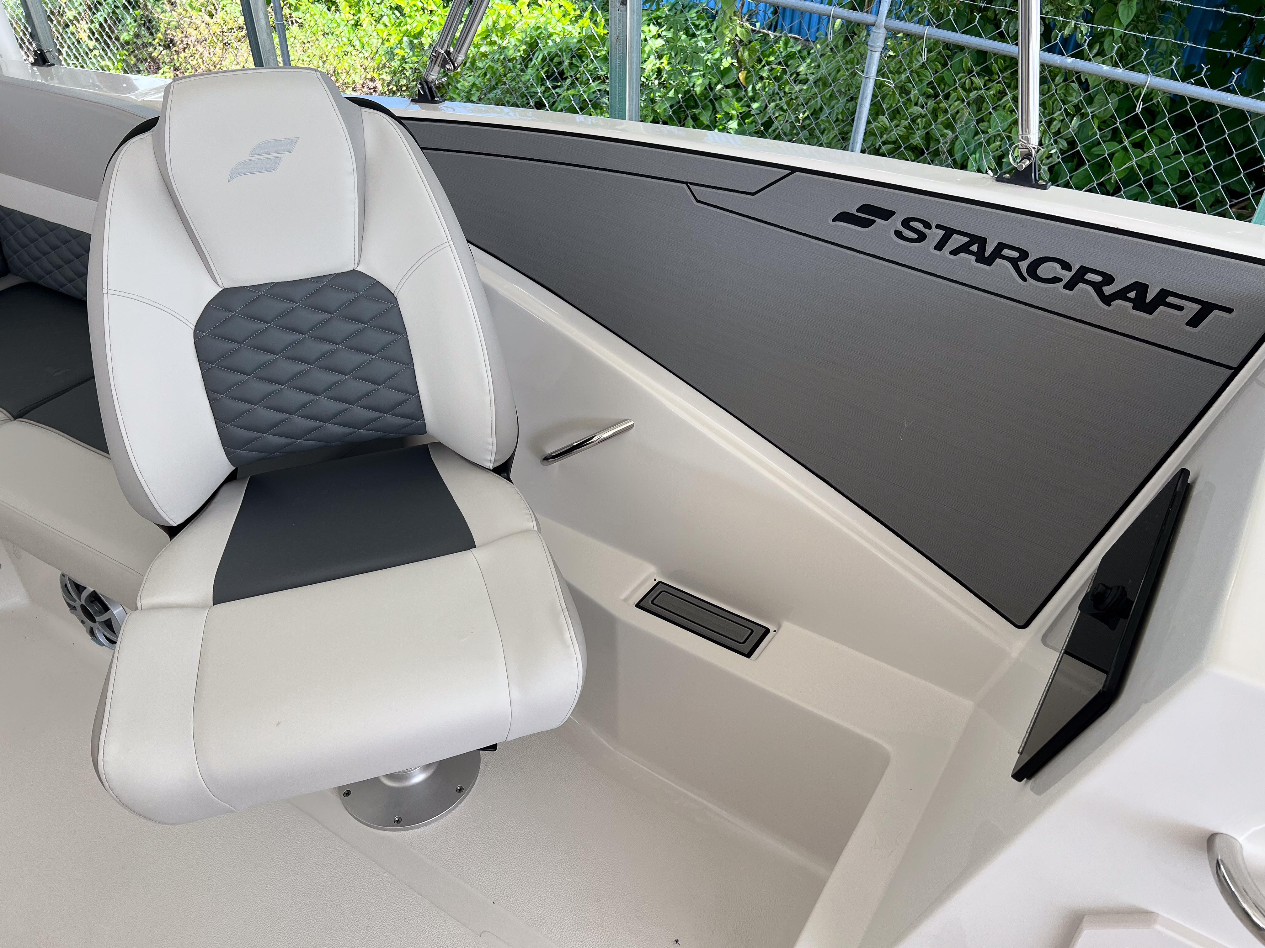 2026 Starcraft SVX 231 OB boat interior with white and gray seating, sleek design.