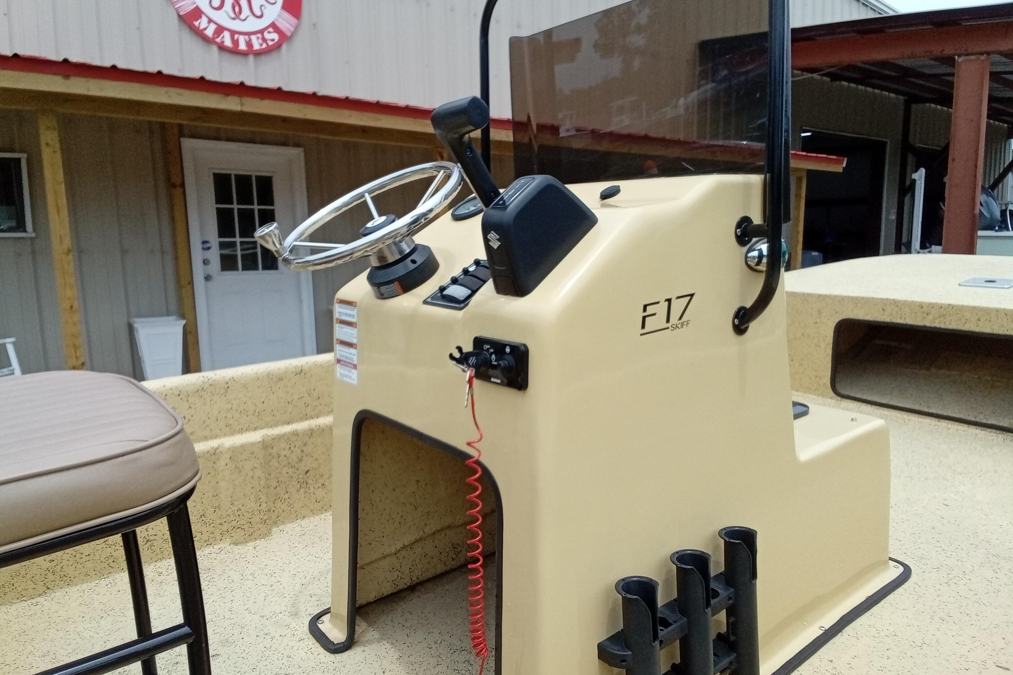 Fibercraft F17 Skiff 2025 boat console with steering wheel and controls.
