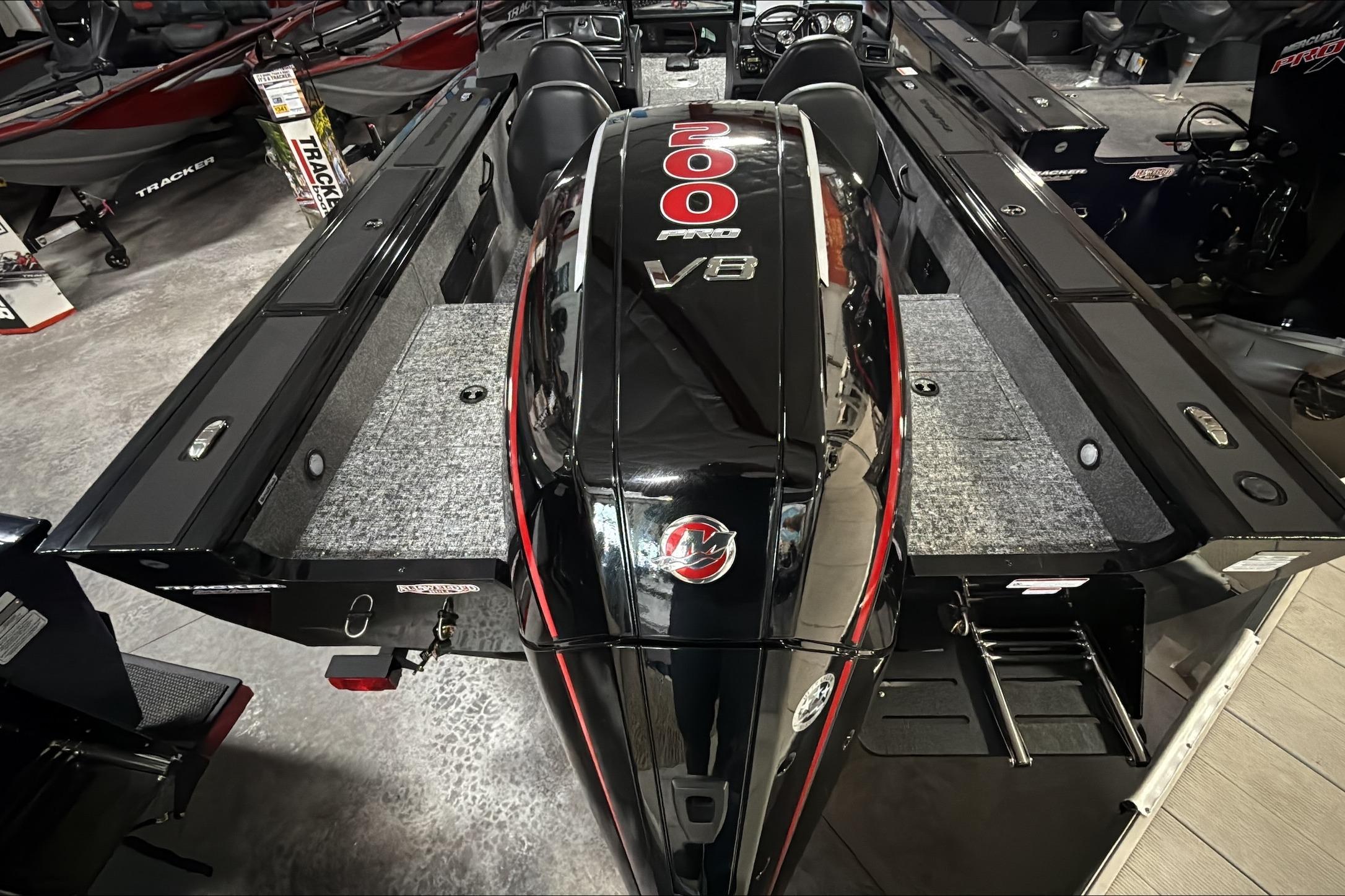 2026 Tracker Targa V-18 WT boat with powerful 200 Pro V8 engine, showcased indoors.