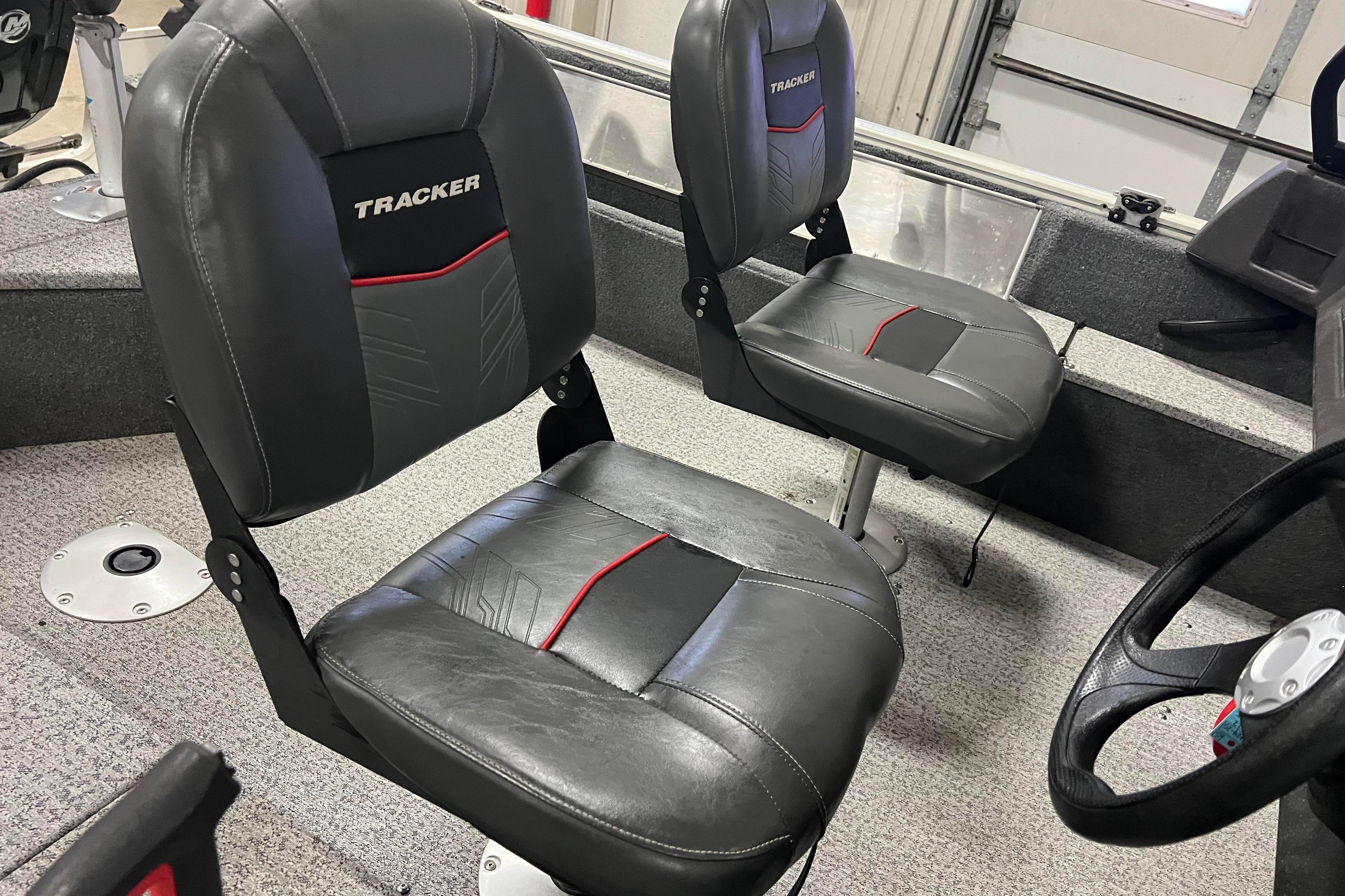 2022 Tracker Pro Guide V-16 WT boat interior with black and red seats.