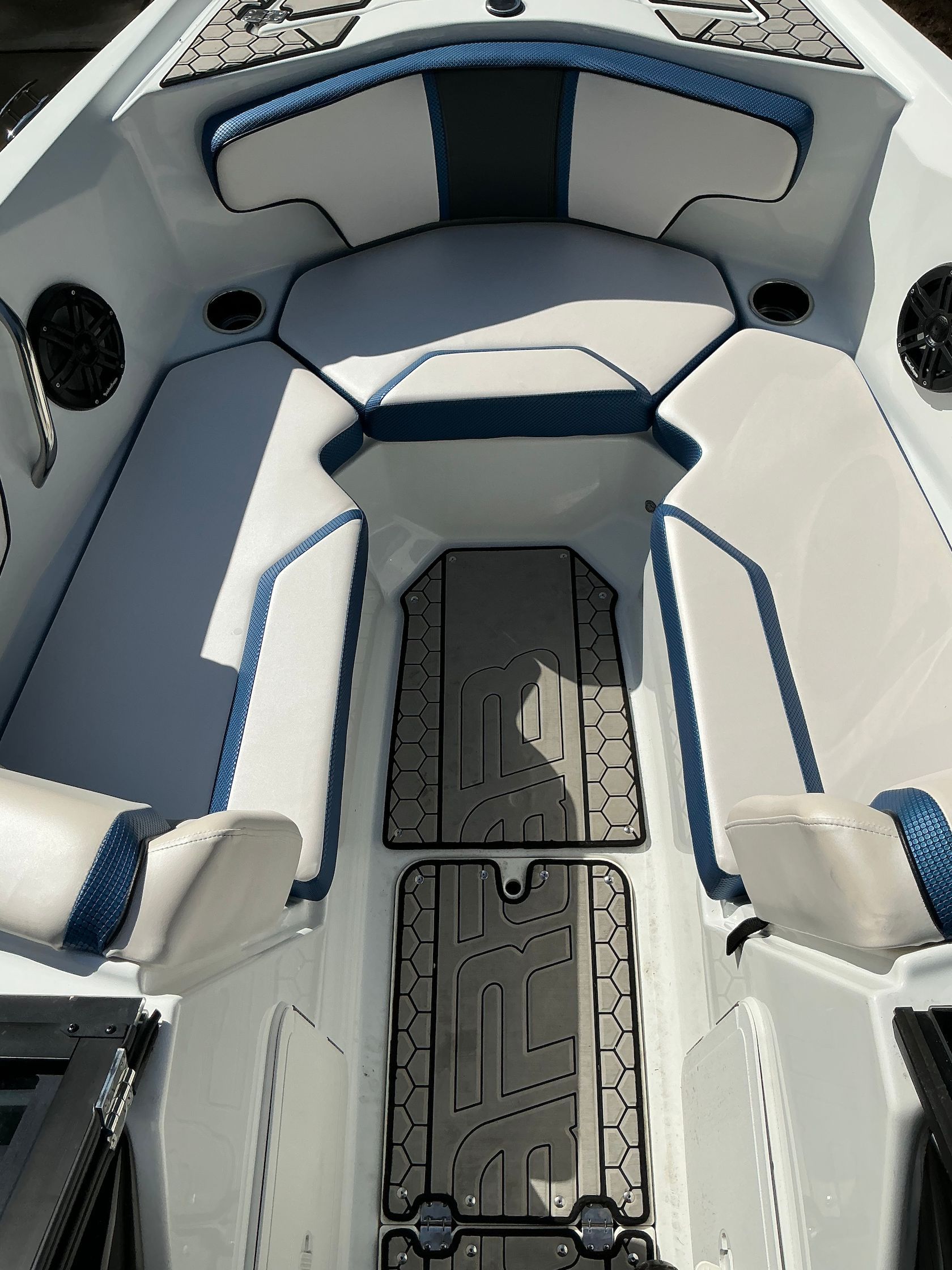 Interior of 2021 Scarab 215 ID boat with cushioned seating.