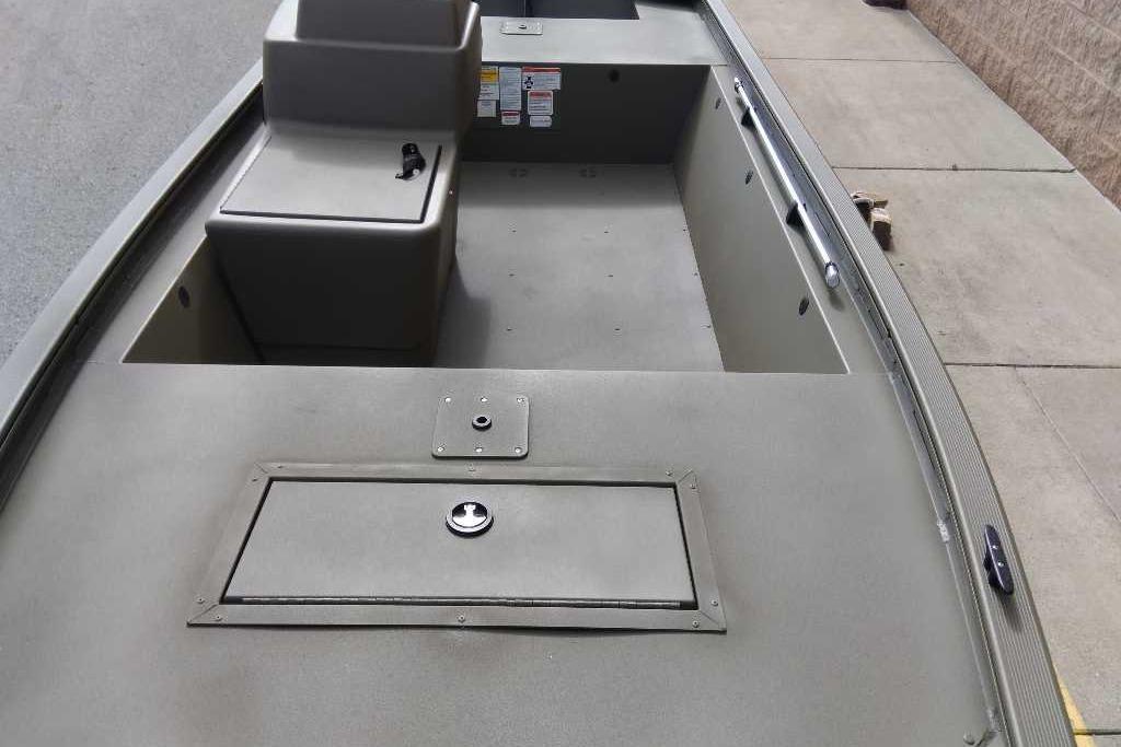 2026 Tracker Grizzly 1648 SC boat interior with storage compartments and seating.