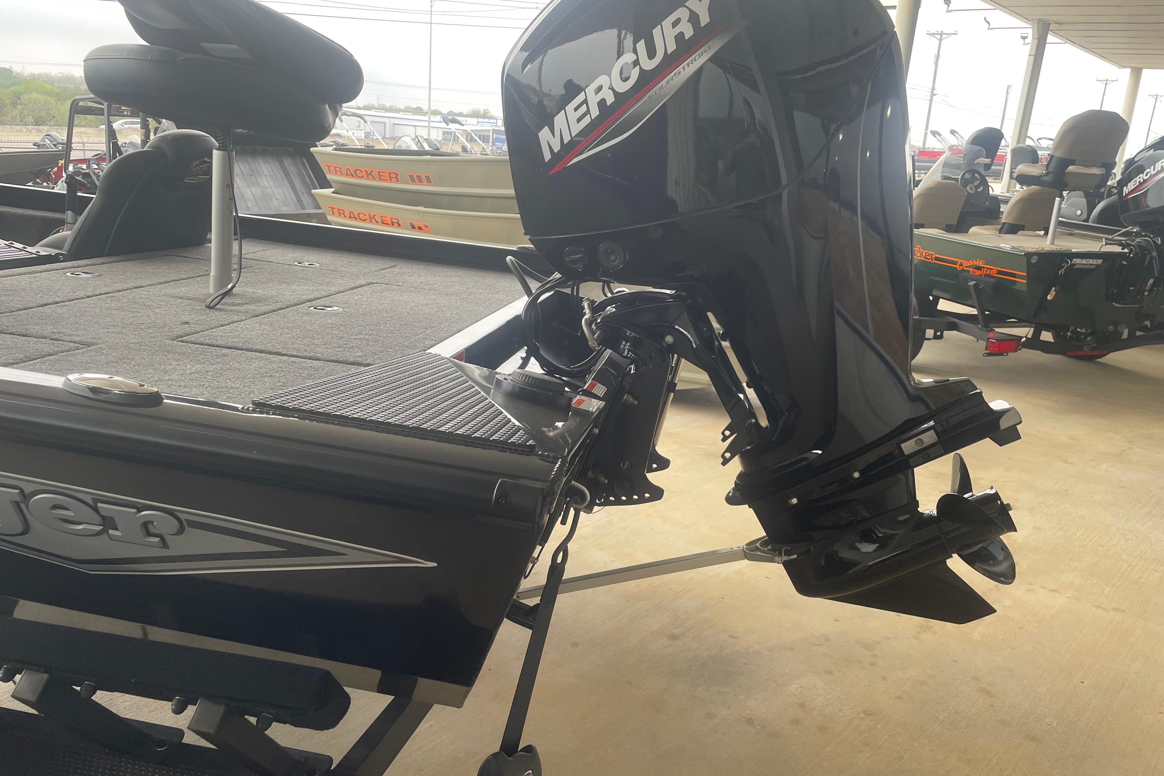 2026 Ranger RT178 boat with Mercury outboard motor in showroom.