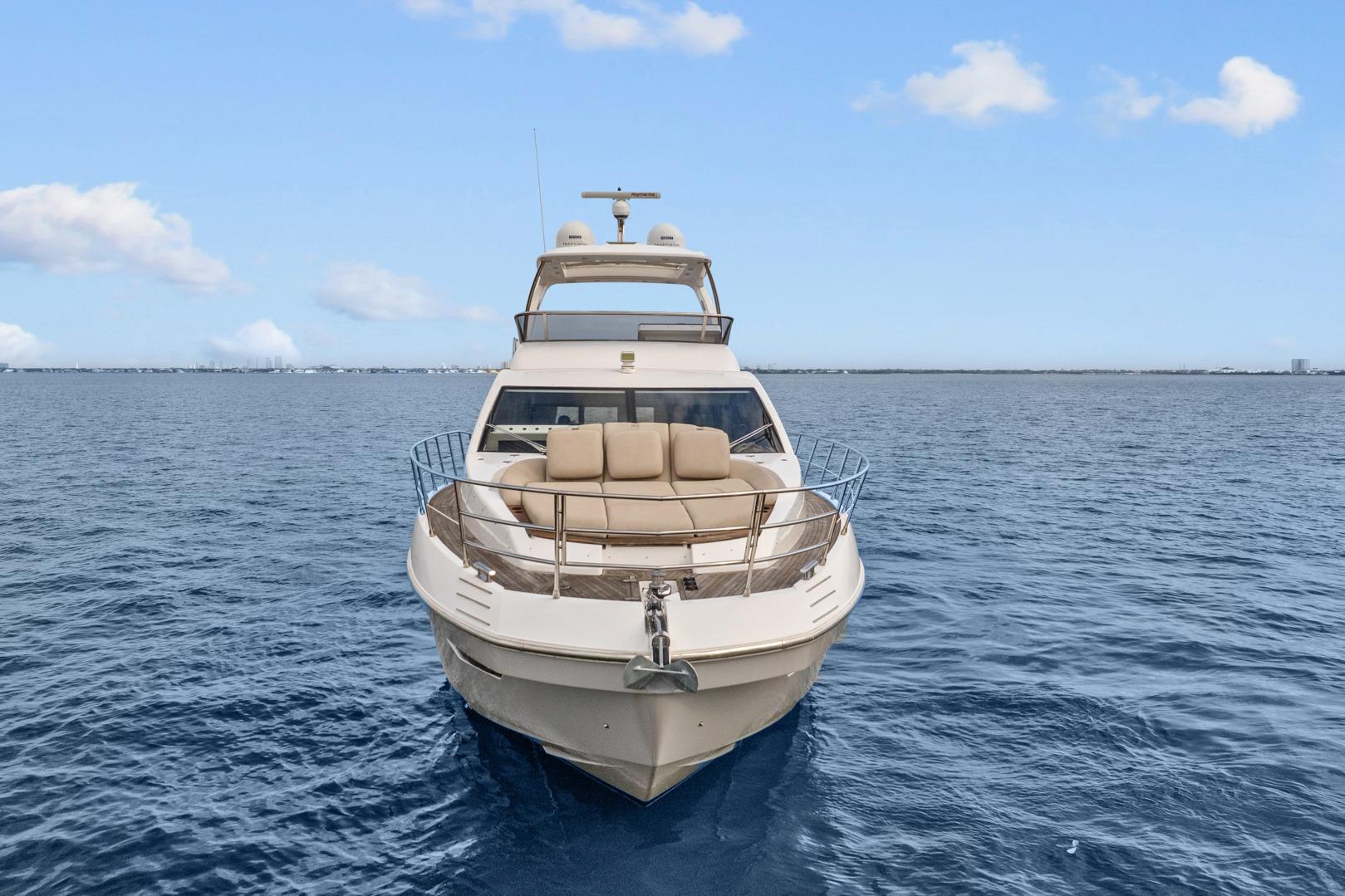 2019 Azimut 55 yacht cruising on open sea under clear blue sky.