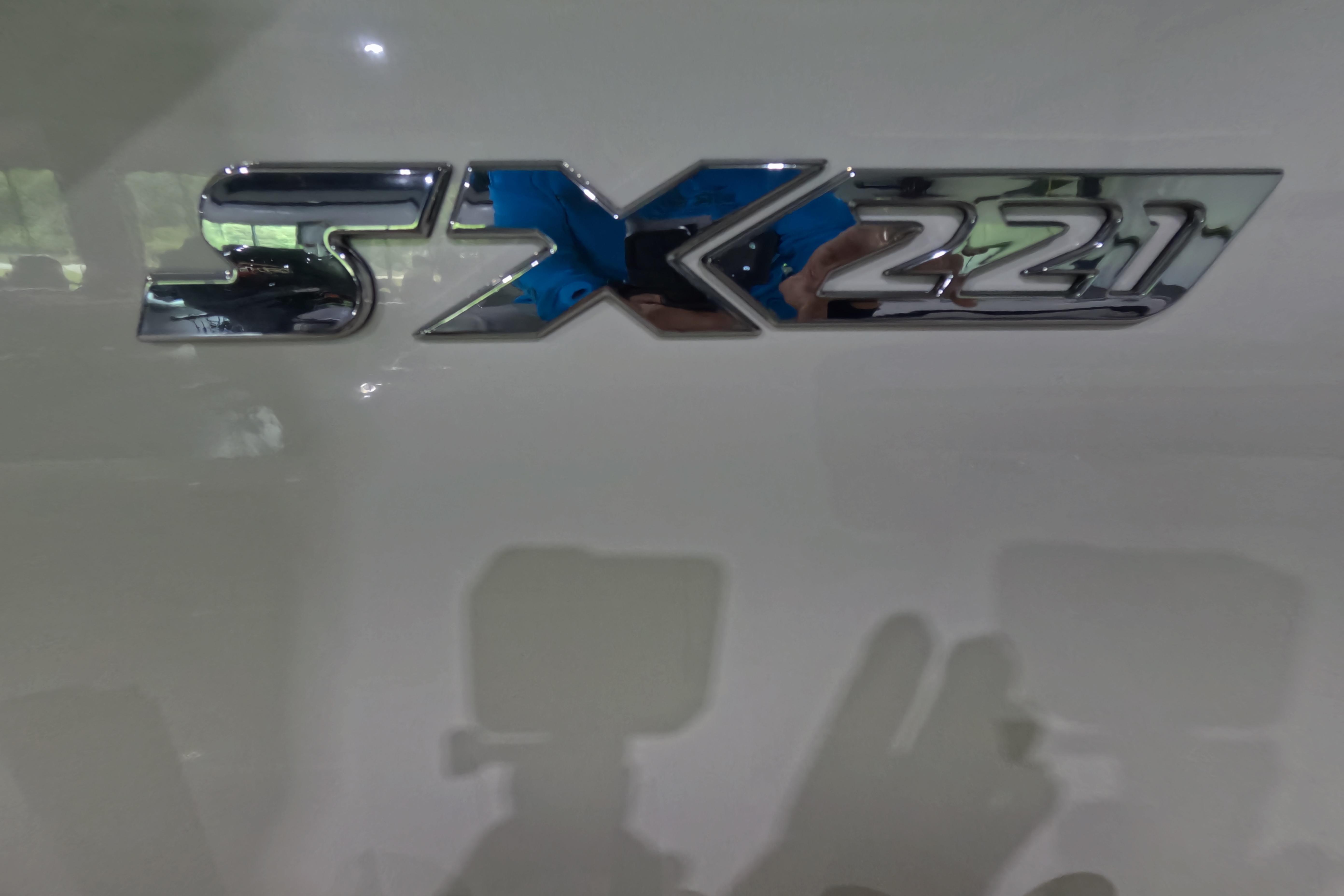 Chrome "SX221" emblem on a 2026 Skeeter boat.