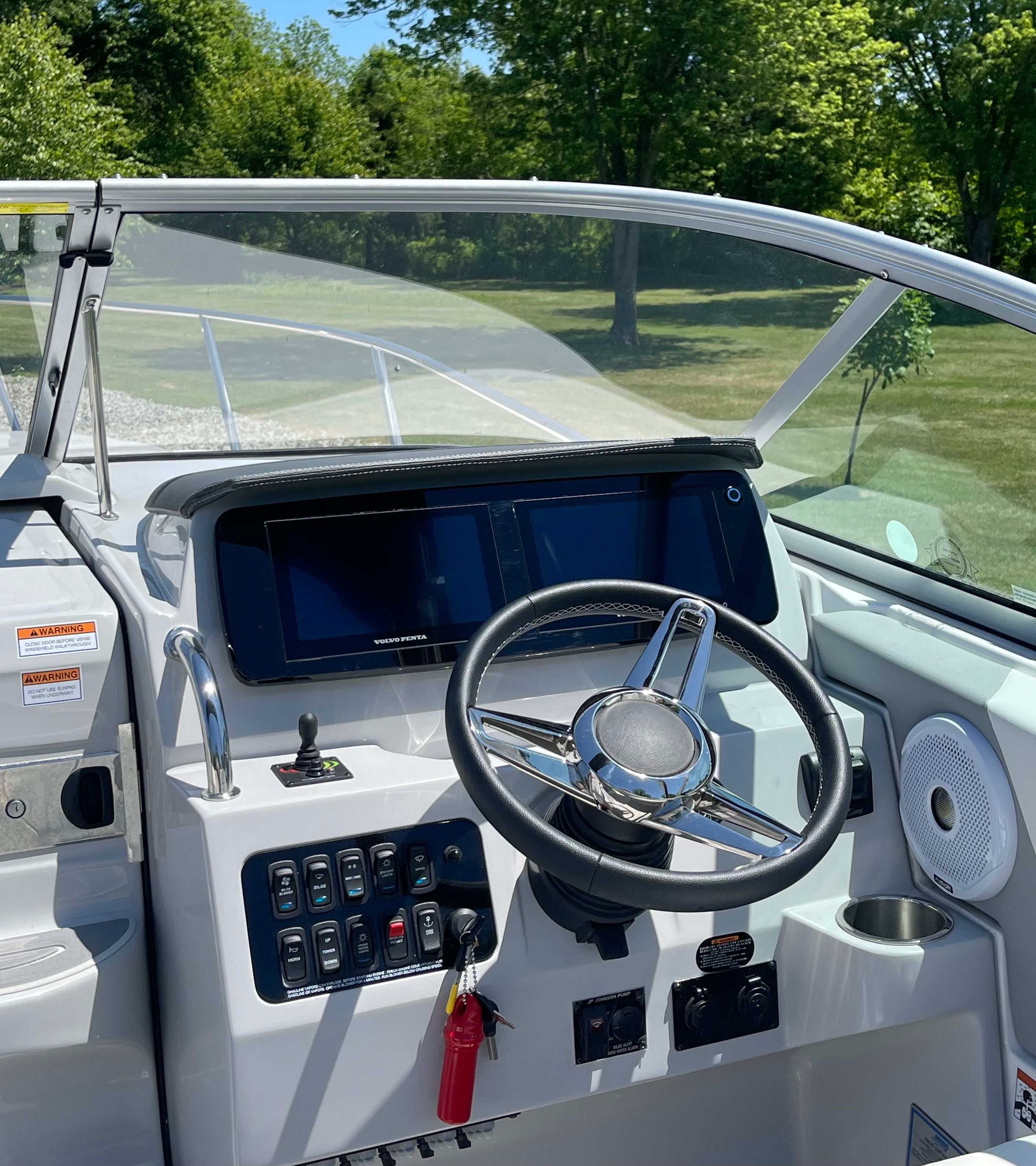 Cockpit of 2022 Regal 26 Express with steering wheel and controls.
