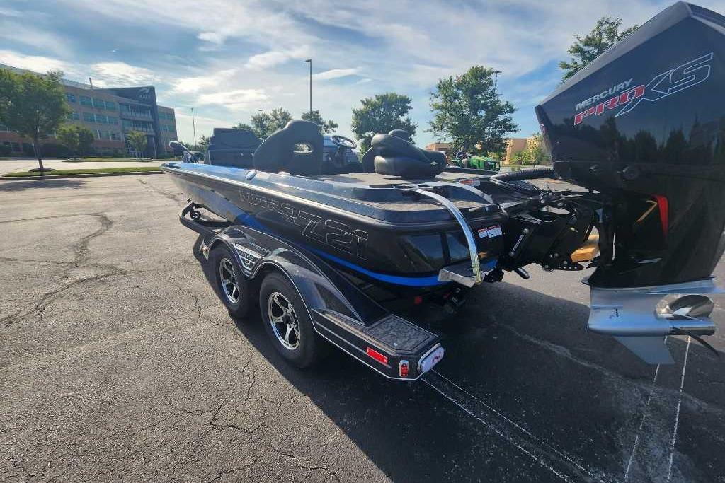 2025 Nitro Z21 XL boat with Mercury Pro XS engine in a parking lot.