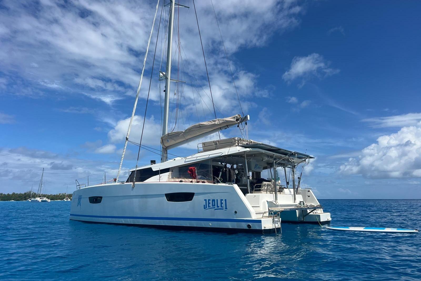 2022 Fountaine Pajot Elba 45 Catamaran sailing on clear blue ocean.