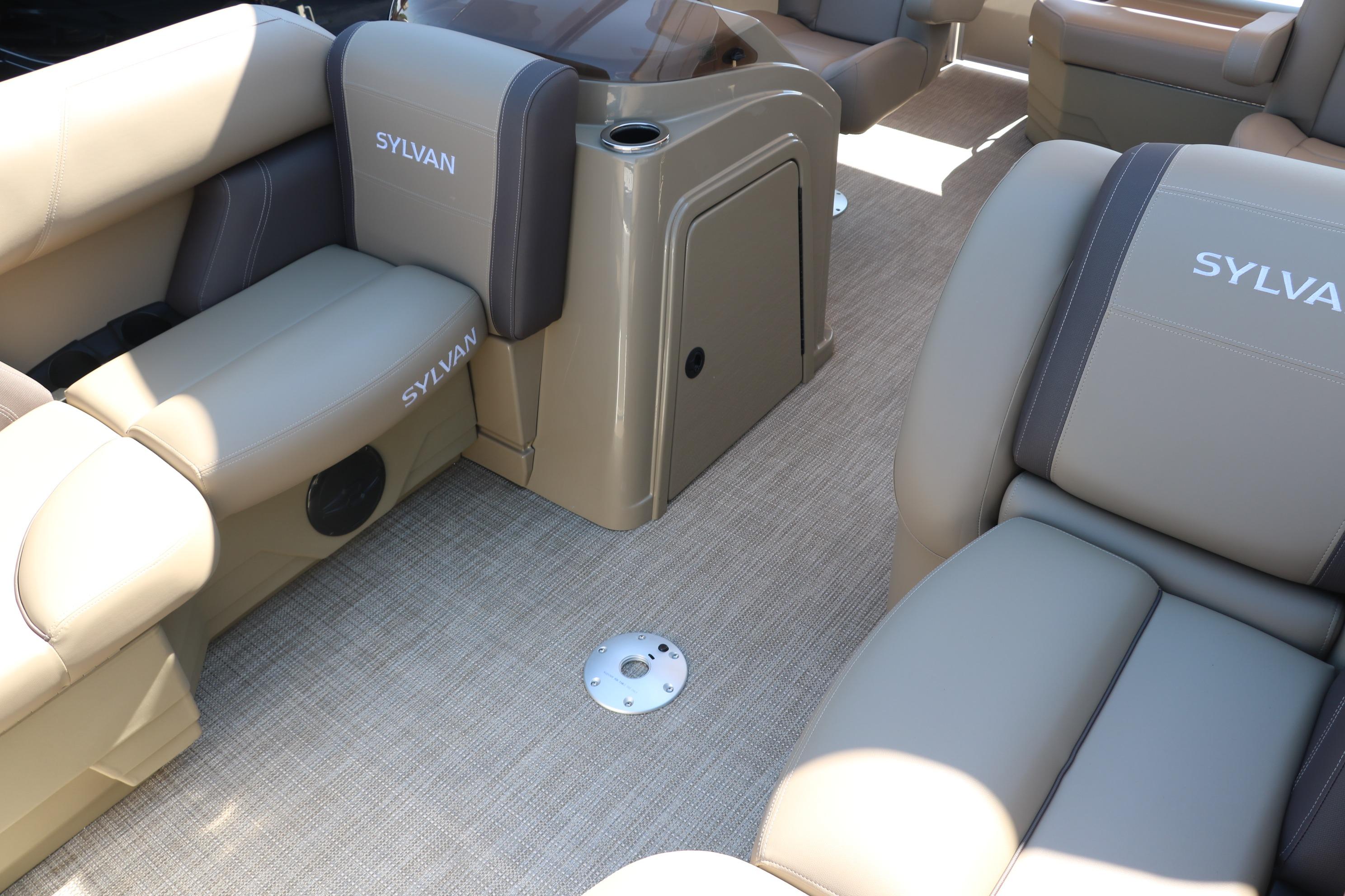 Interior of 2025 Sylvan Mirage 820 CLZ DH pontoon boat with beige seating.