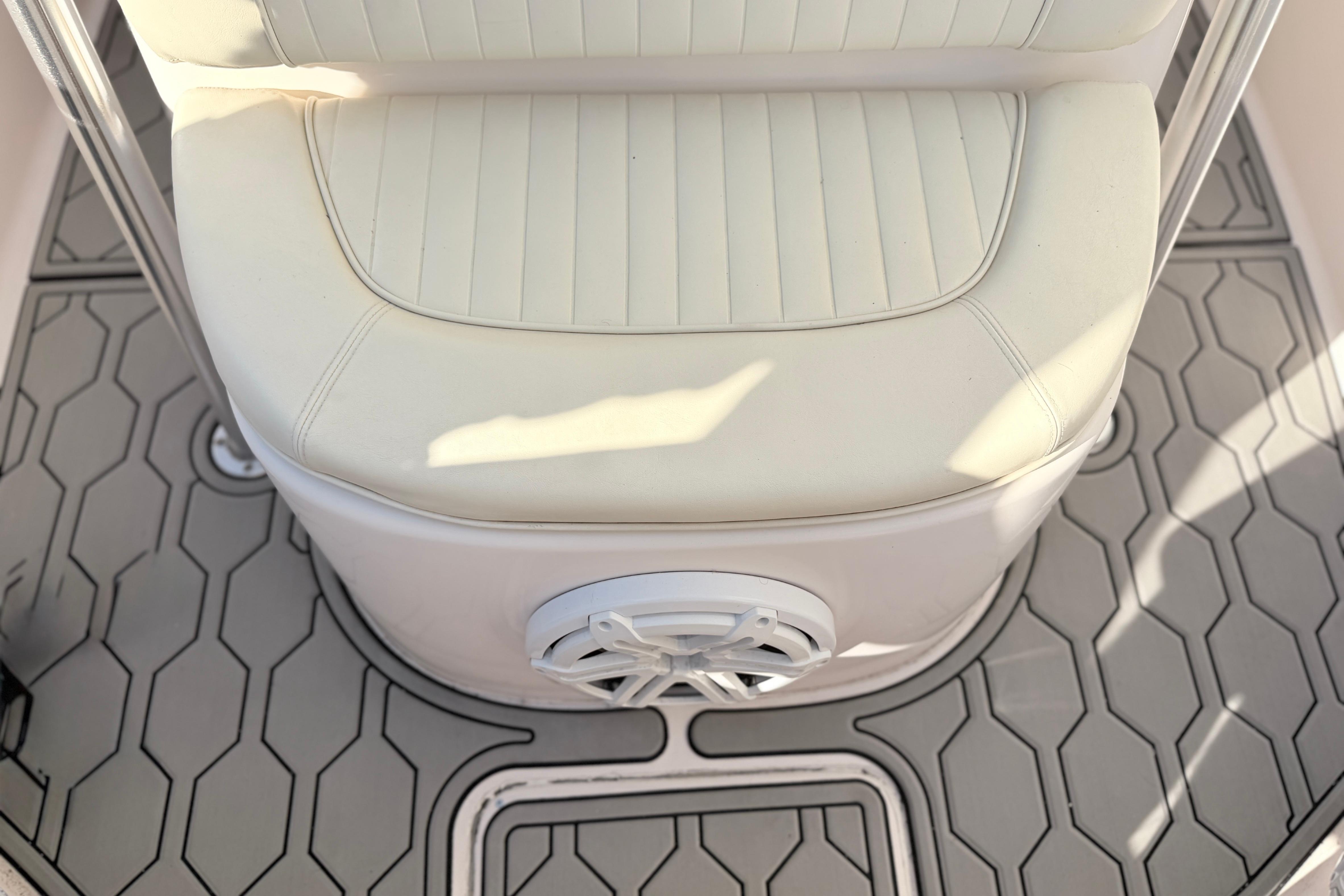 2004 Grady White 273 boat seat with hexagonal patterned flooring.