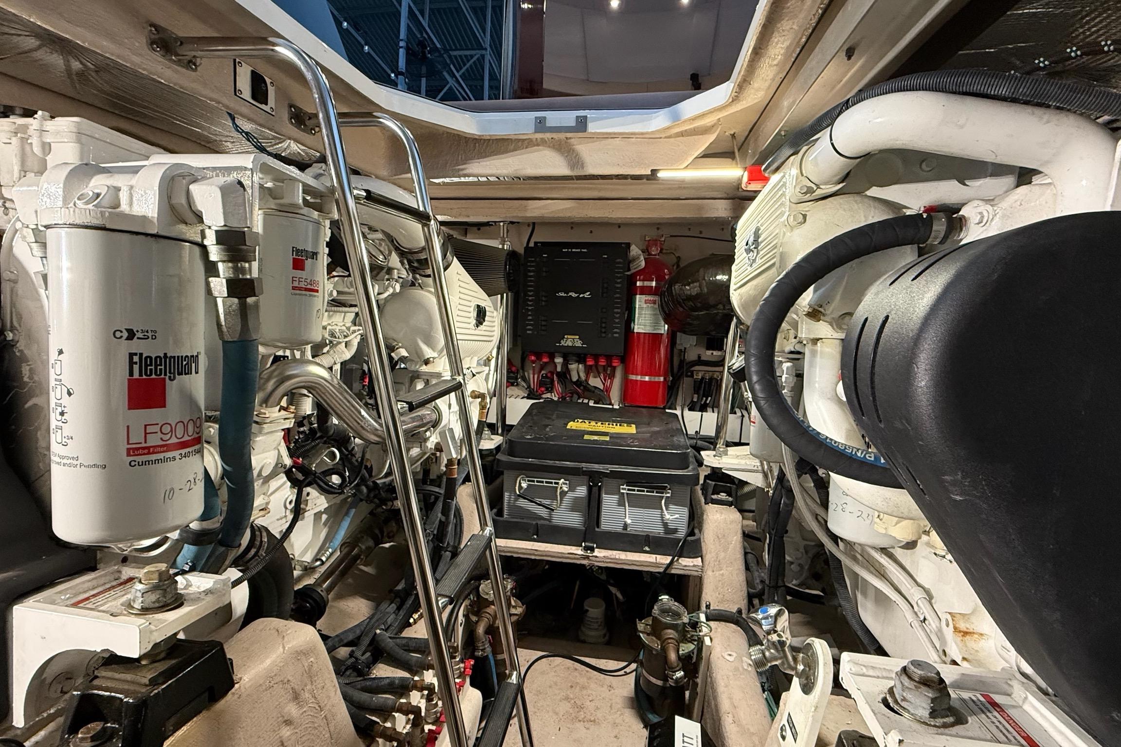Engine room of 2009 Sea Ray 47 Sedan Bridge with mechanical components and filters.