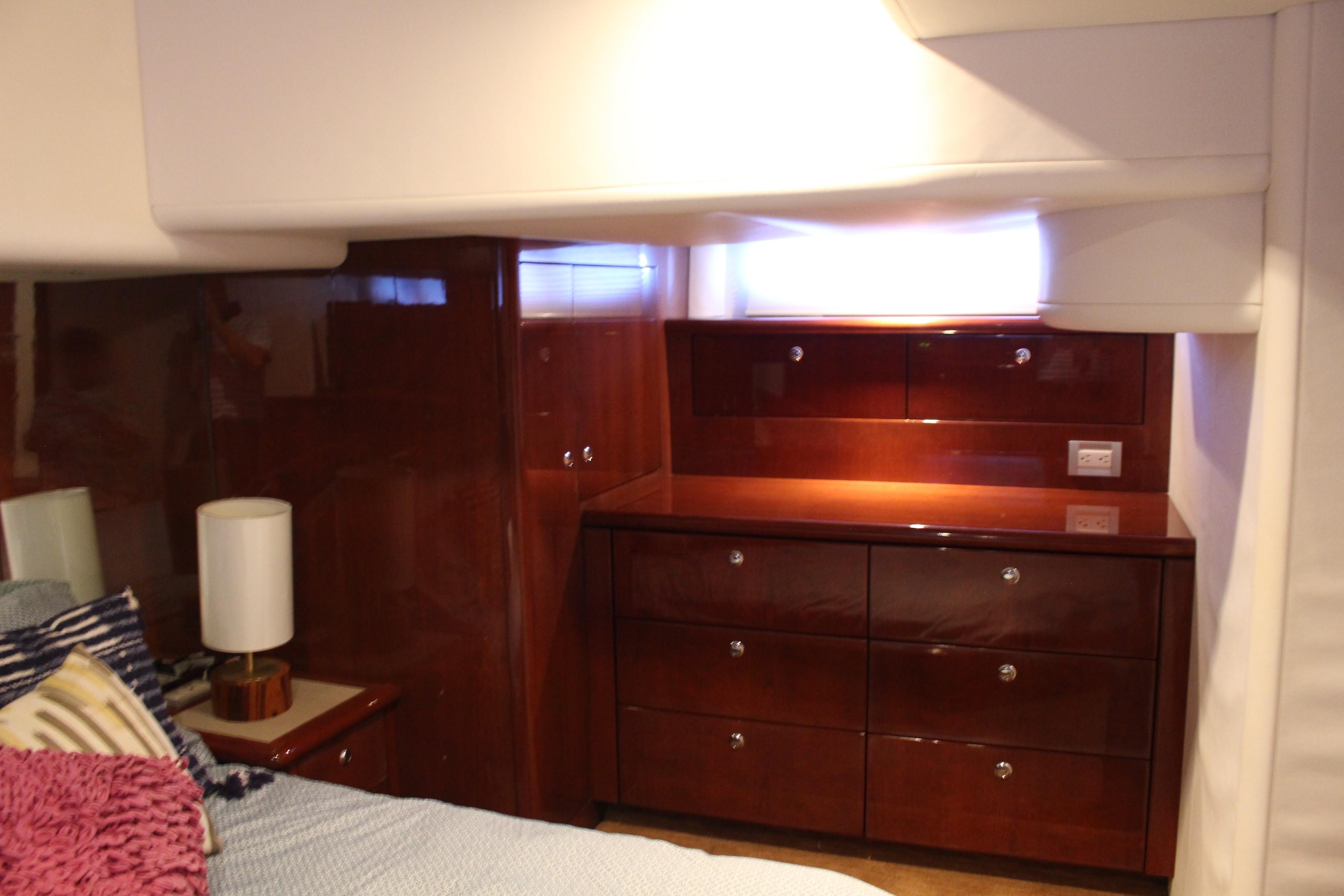 Luxurious cabin interior of 2006 Neptunus 55 Cabrio yacht with polished wood finish.