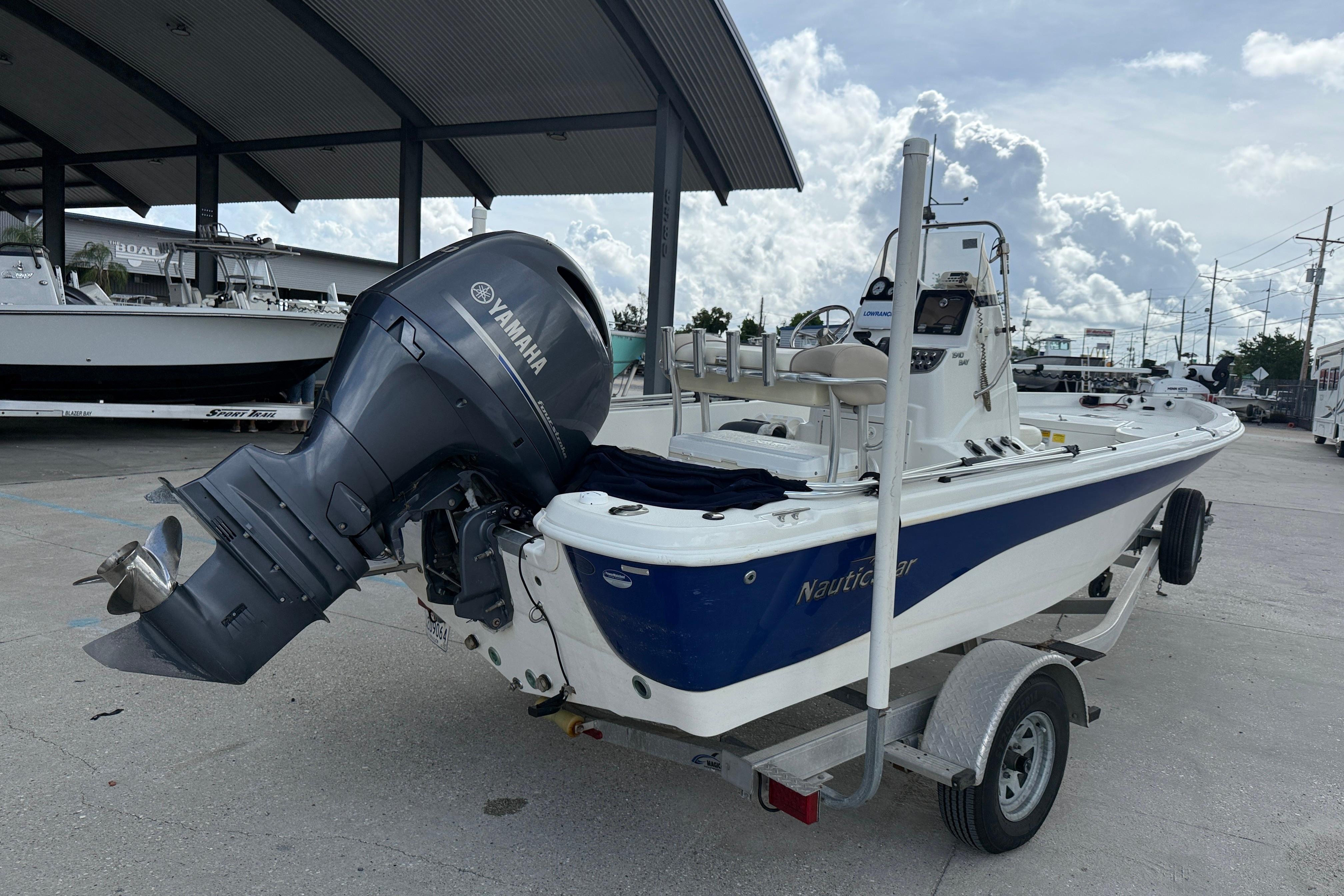 2017 NauticStar 1910 NauticBay boat with Yamaha outboard motor on trailer.