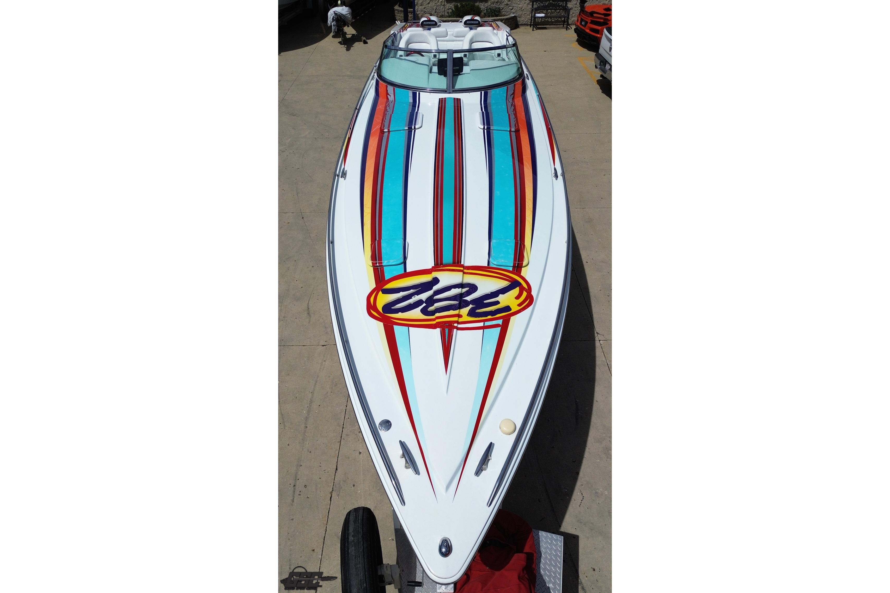 2002 Formula 382 FASTech boat with vibrant striped design on deck.