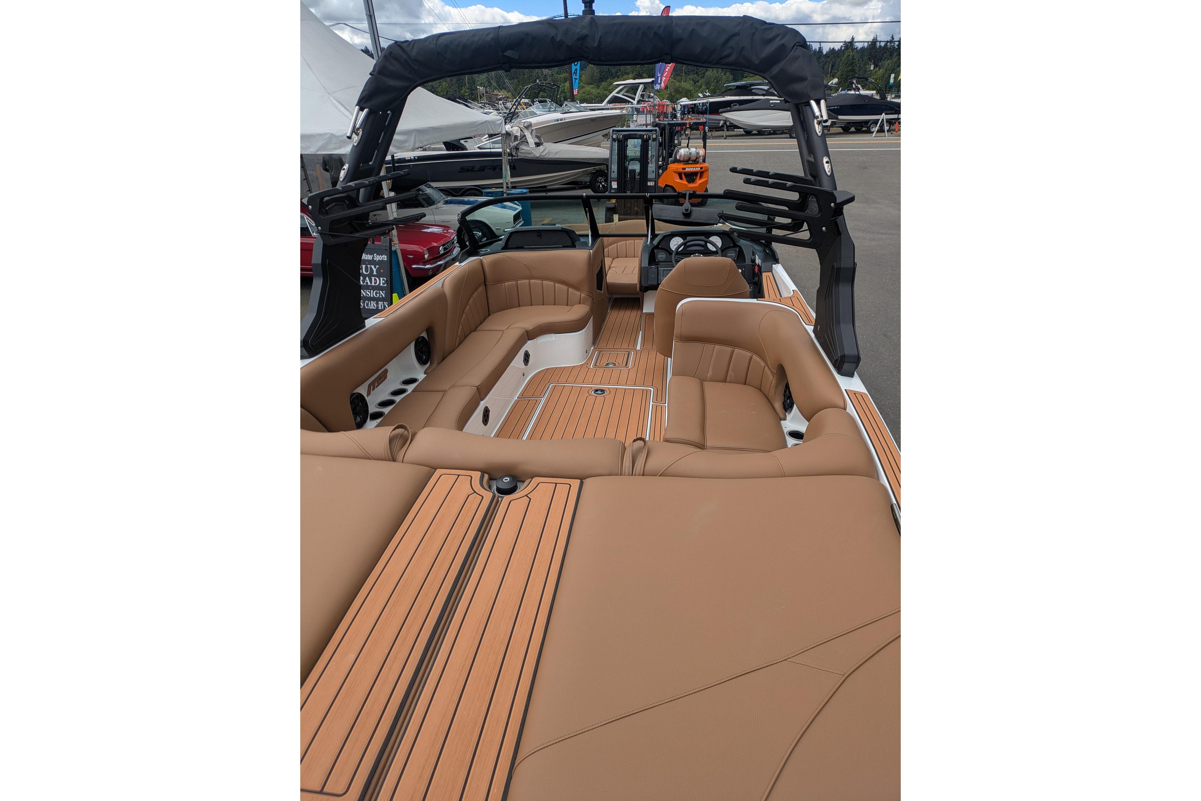 2026 MB B52-23 Classic LIMITED boat with luxurious tan seating and sleek design.