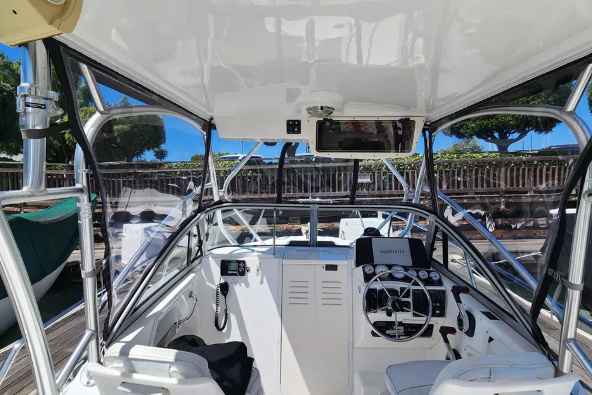 Interior view of a 2000 Boston Whaler 21 Conquest boat with navigation equipment.