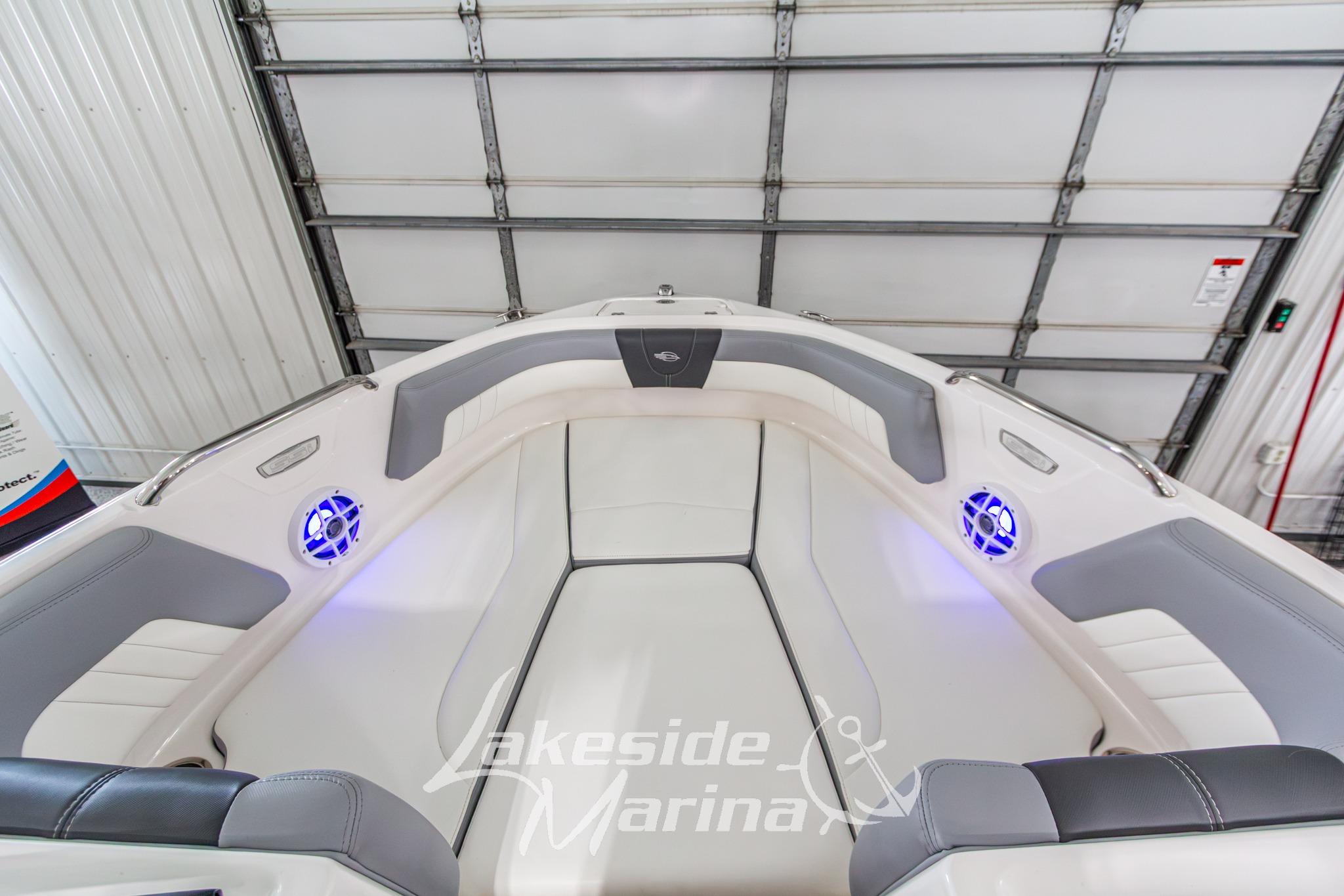 2022 Chaparral 21 SSi boat interior with gray and white seating, blue LED lights.