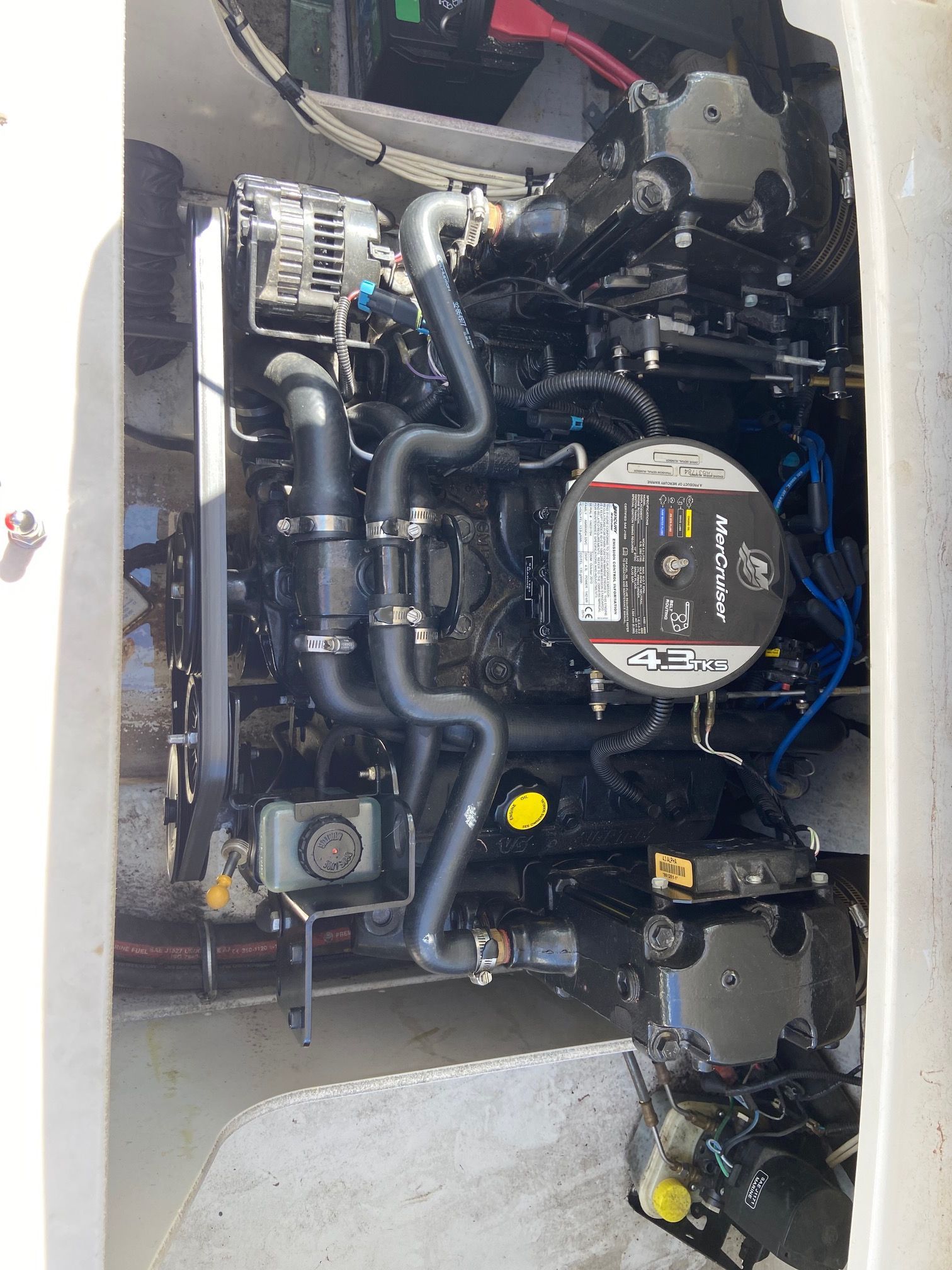 Engine compartment of a 2011 Crownline 21 SS boat with a MerCruiser engine.