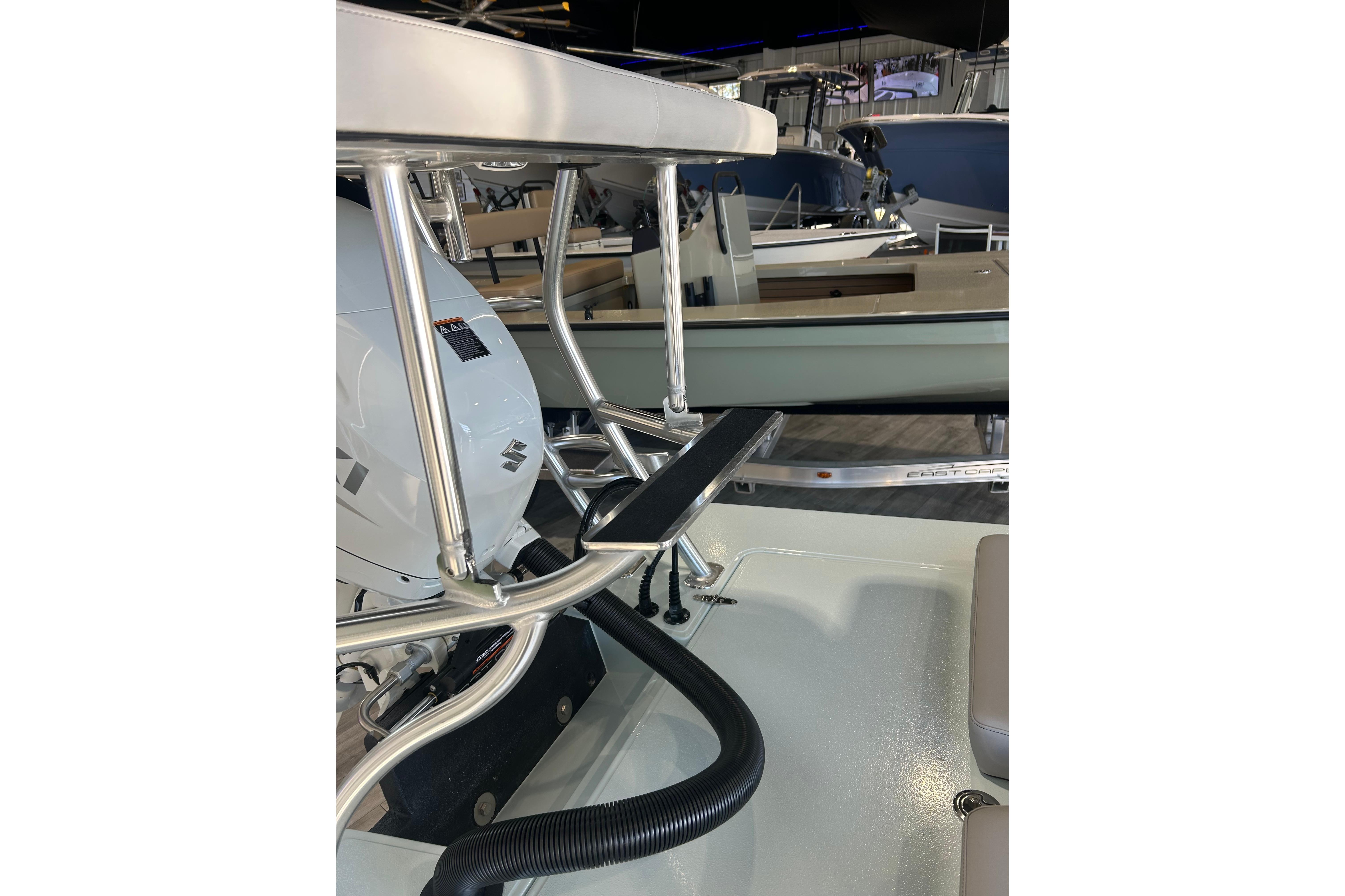 2026 East Cape Evo 17X boat interior with engine and seating details.