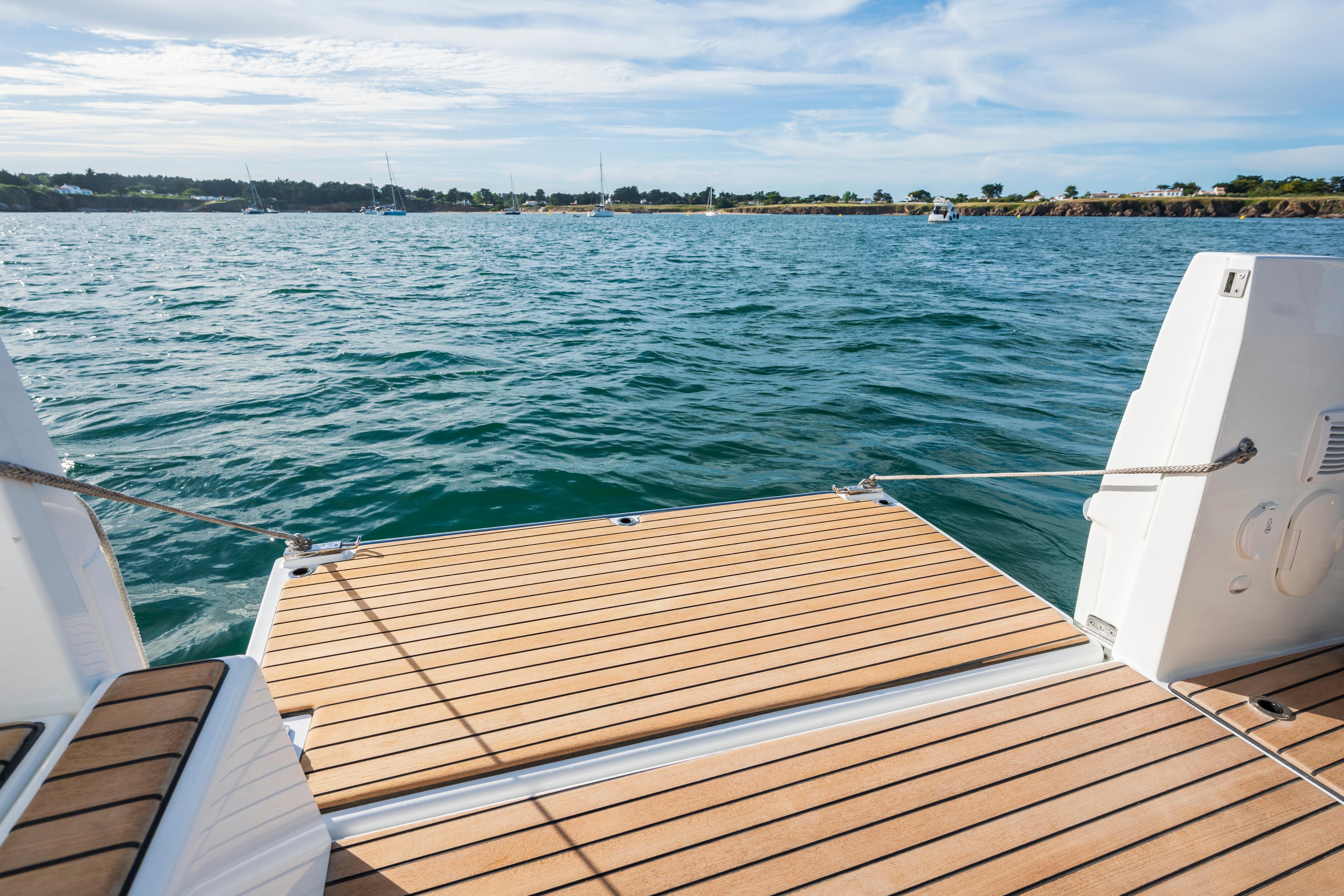 2026 Beneteau Antares 11 Coupe boat deck overlooking serene ocean waters.