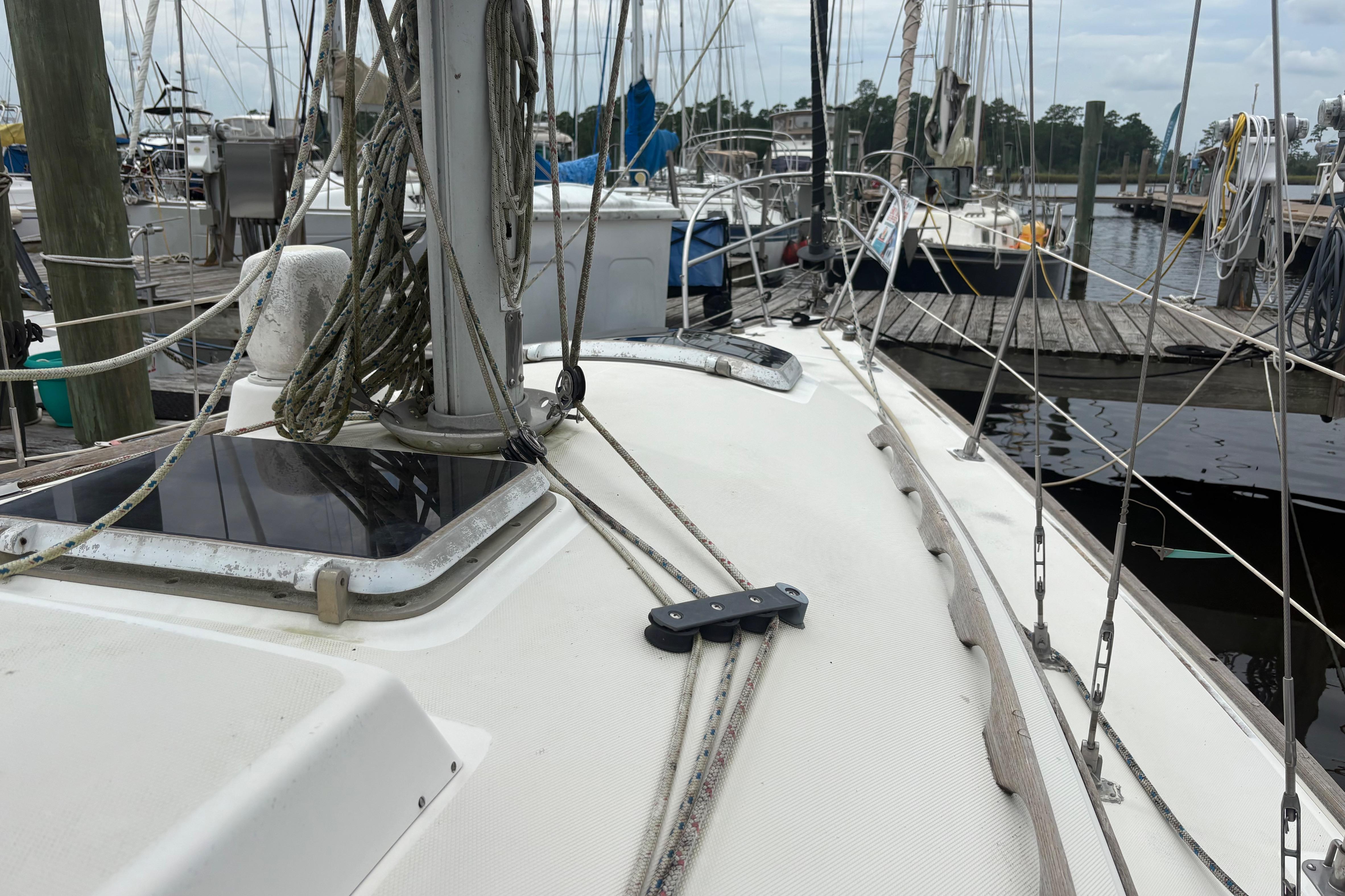 1981 Sabre 31 sailboat docked at marina, showing deck and rigging details.