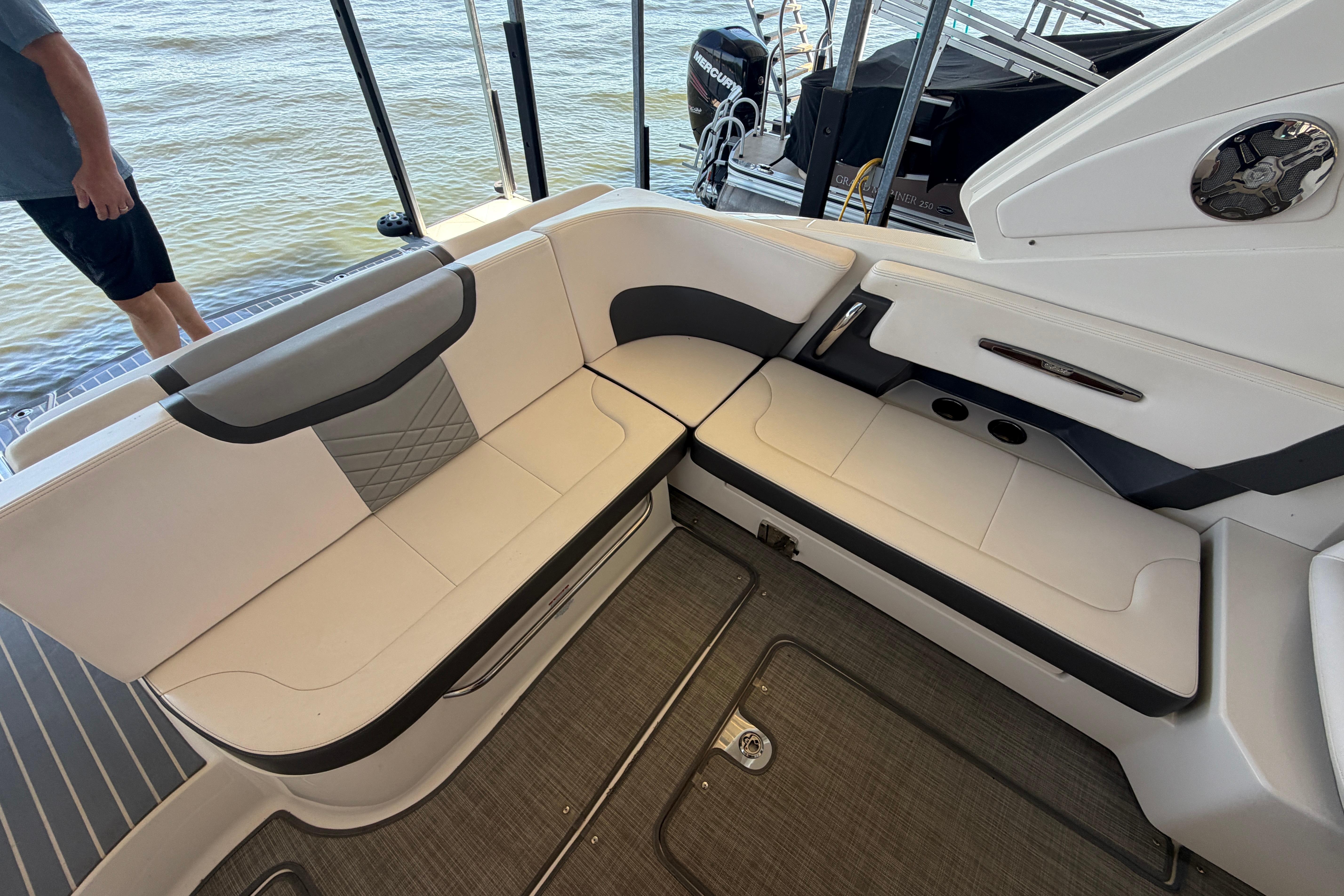 2018 Chaparral 347 SSX boat interior with white seating and water view.