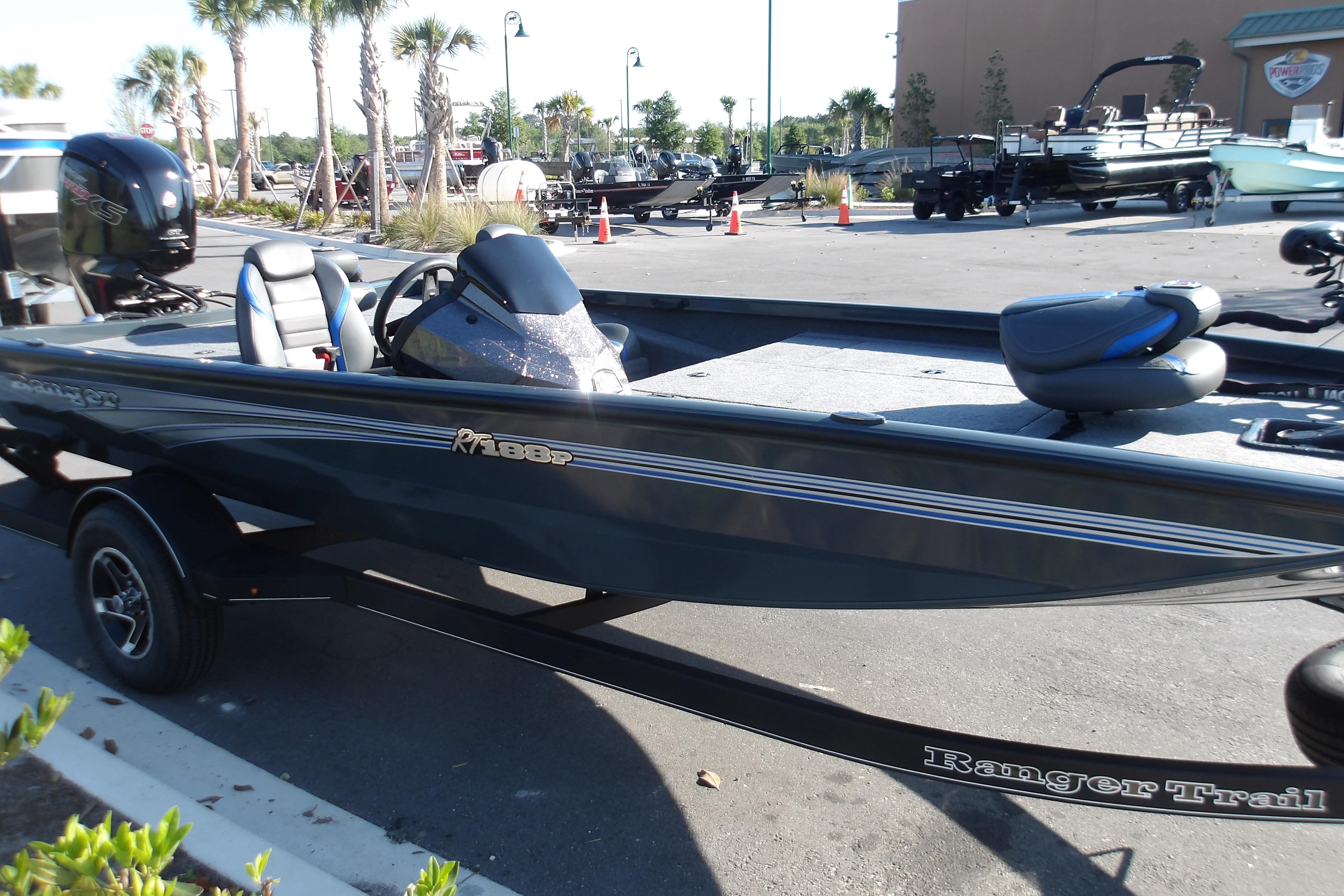 2024 Ranger RT188P fishing boat on trailer, parked outdoors.