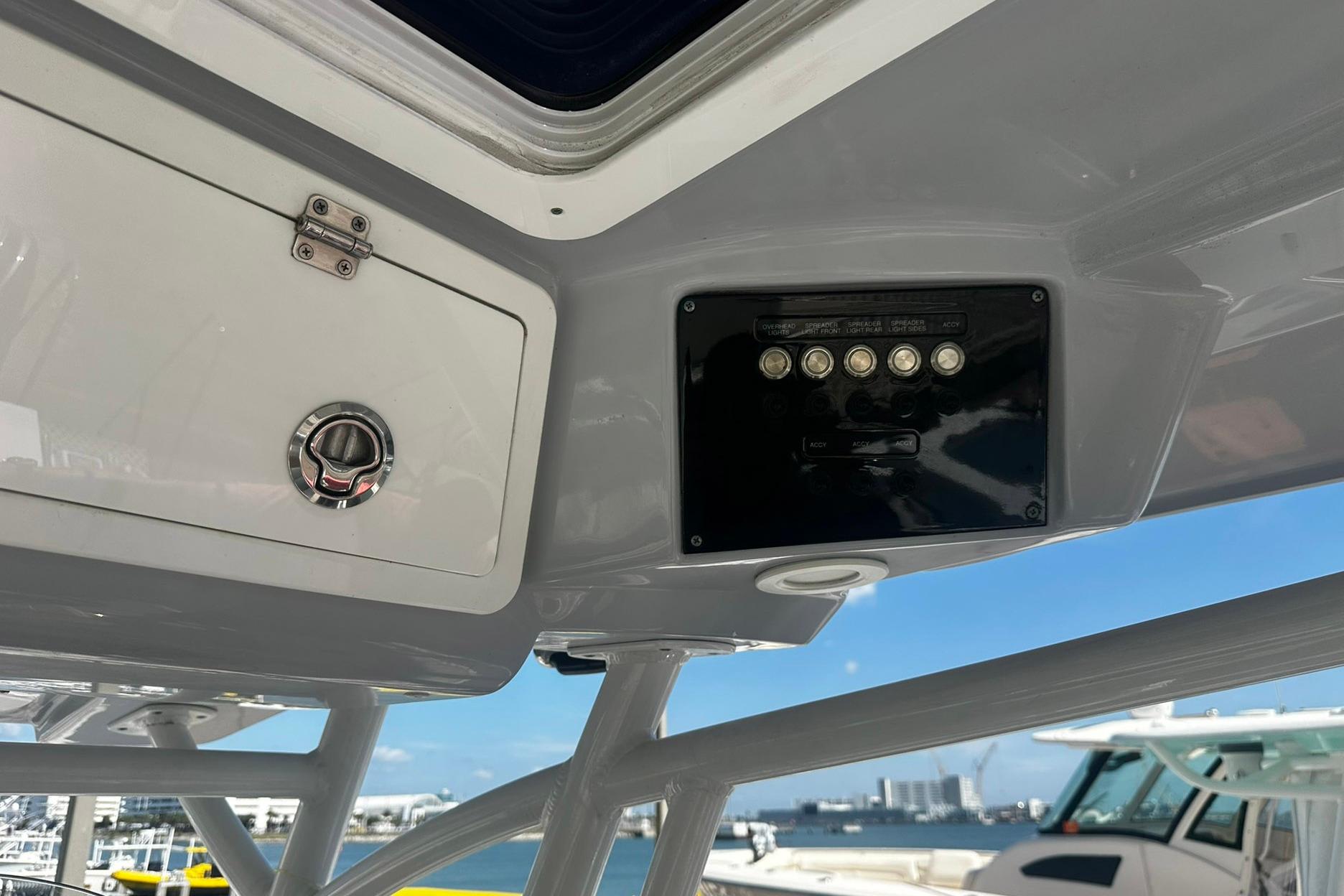 2002 Sea Fox 228 Commander boat console with control panel and storage compartment.