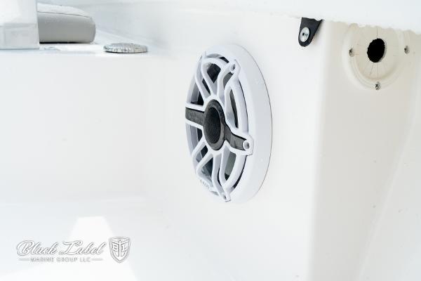 2025 Caymas 281 HB boat speaker detail, featuring sleek white design and modern audio system.