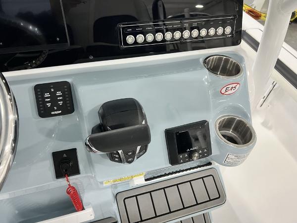 2025 Tidewater 2300 Carolina Bay boat console with controls and cup holders.