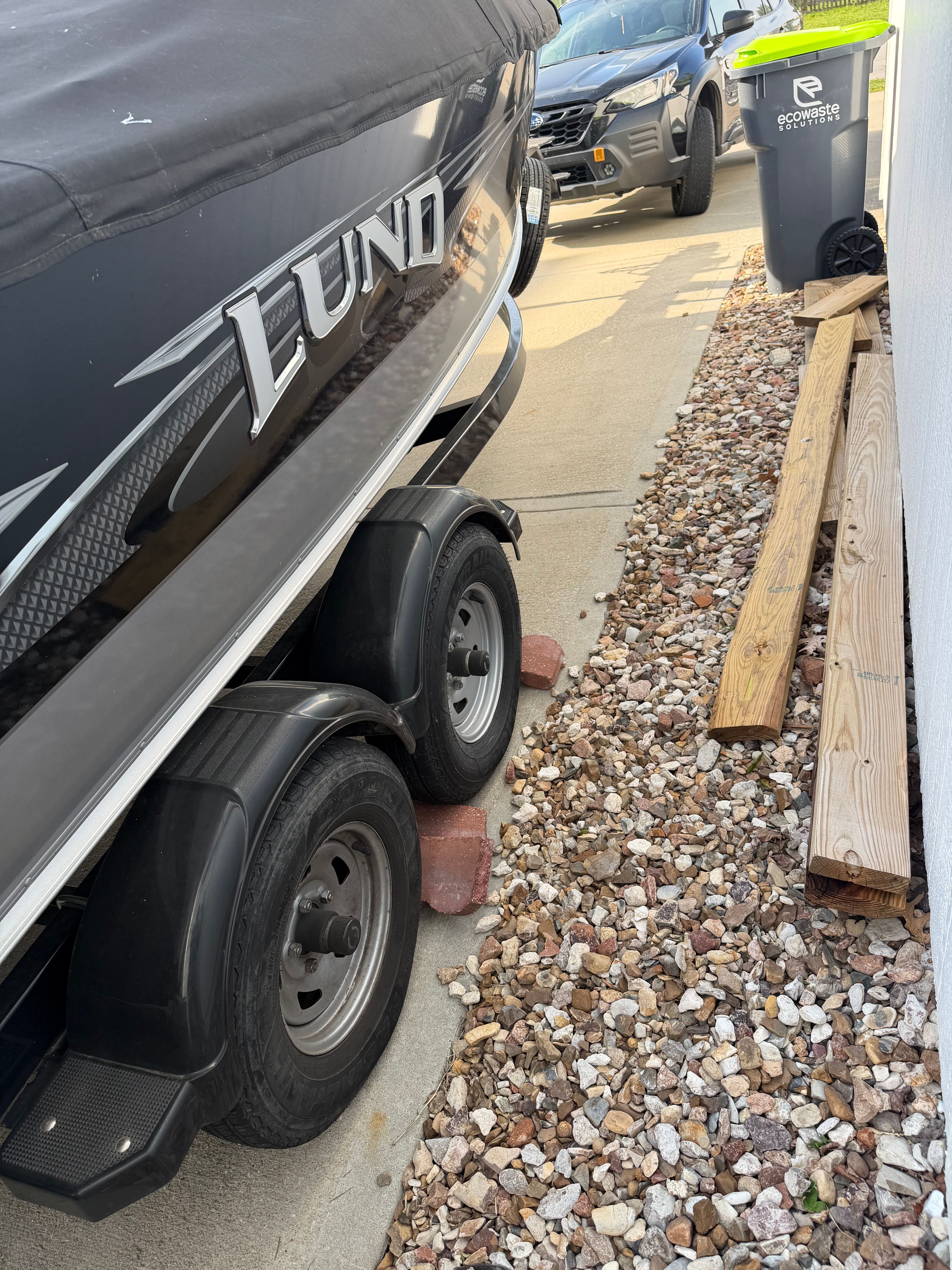 2017 Lund Pro V 1975 boat on trailer, side view.