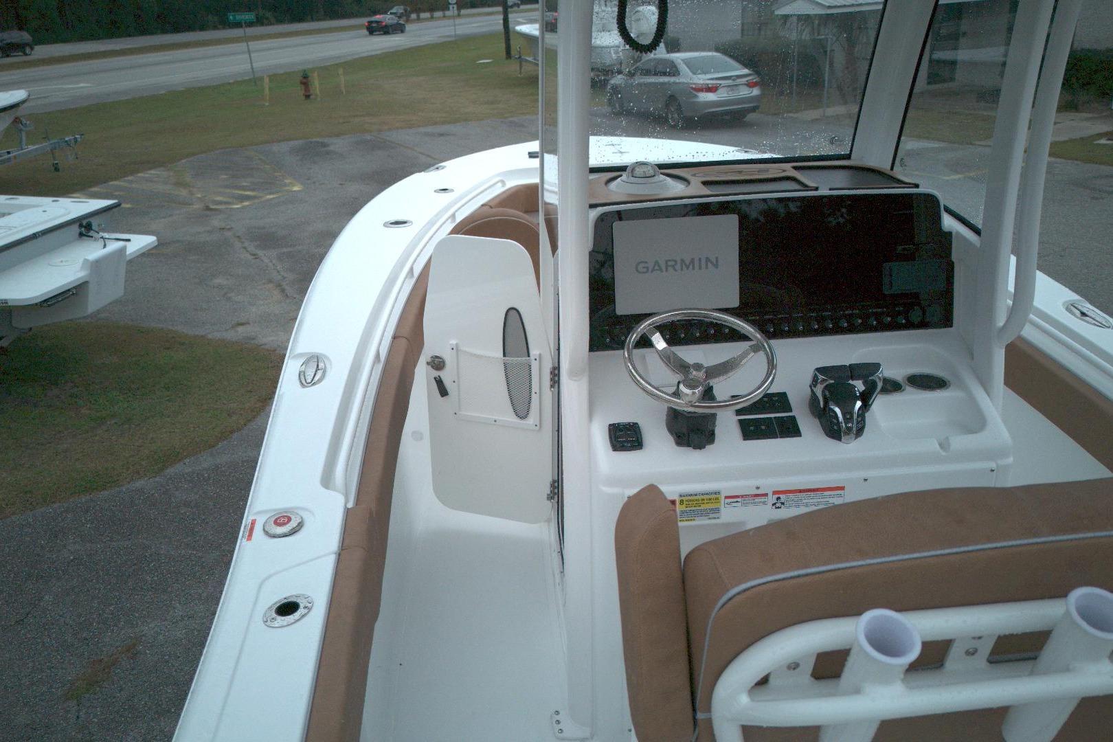 2026 Sea Hunt Gamefish 25 boat interior with Garmin navigation system and steering console.