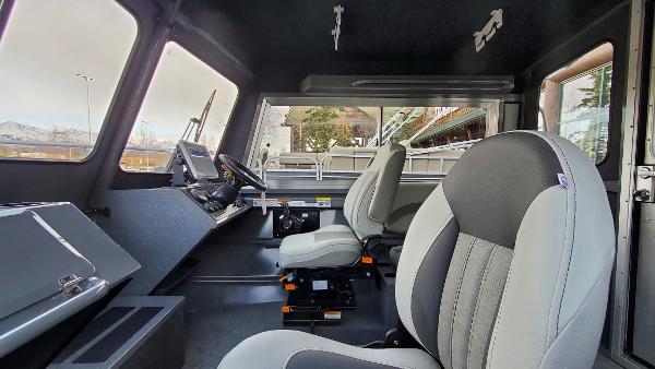 Interior of 2023 Spartan 220 Maximus with modern seating and control panel.