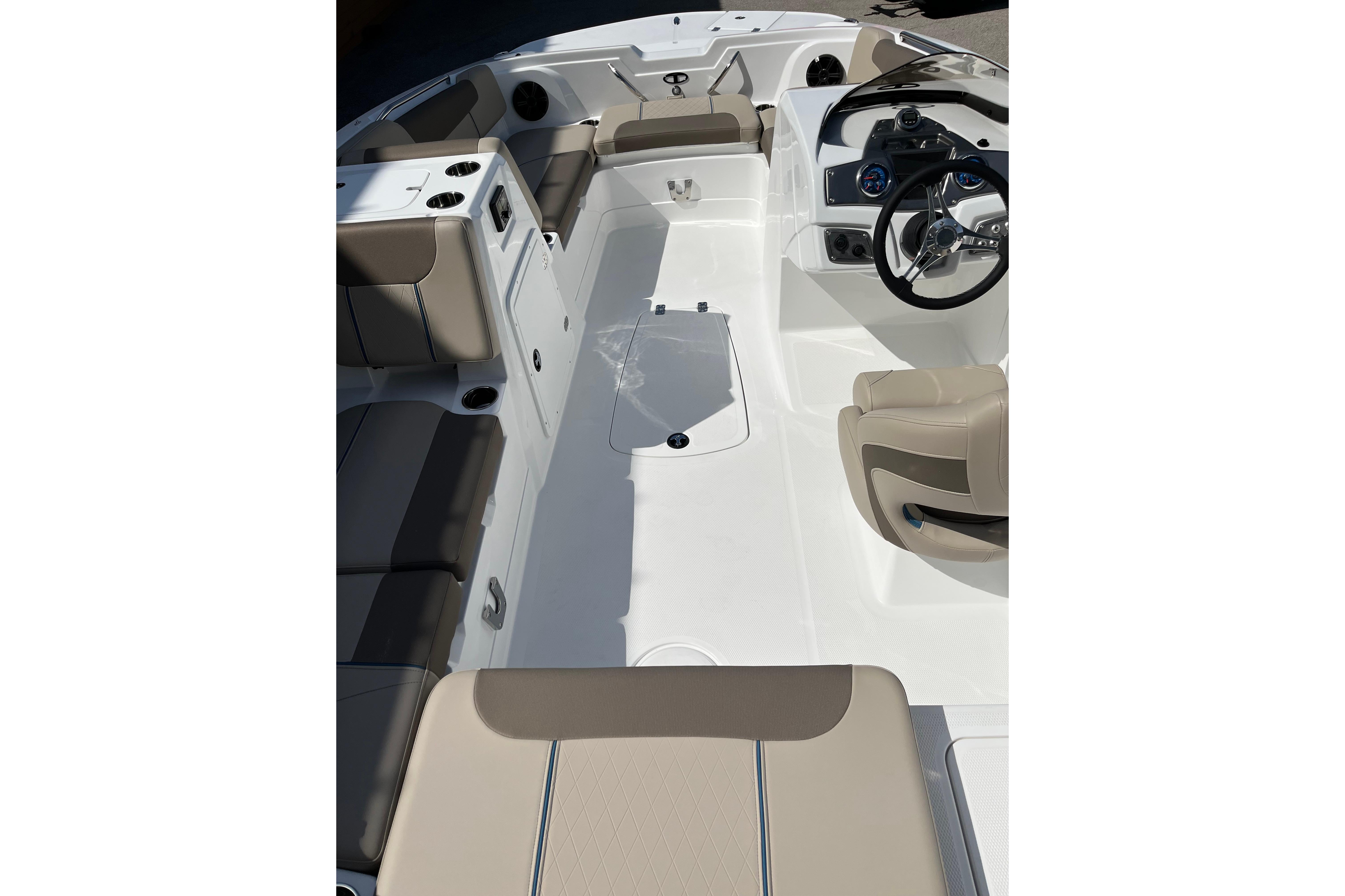 2026 Tahoe 1950 boat interior with beige seating and modern dashboard design.