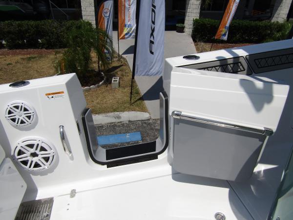 2024 Wellcraft 352 Fisherman boat deck with open side door and speakers.