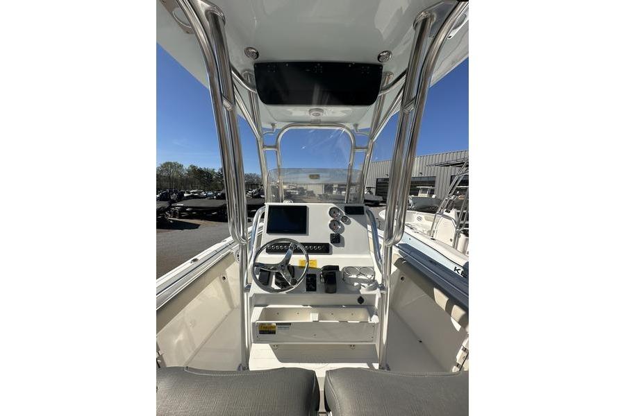 2026 Key West 219 FS boat console with steering wheel and navigation equipment.