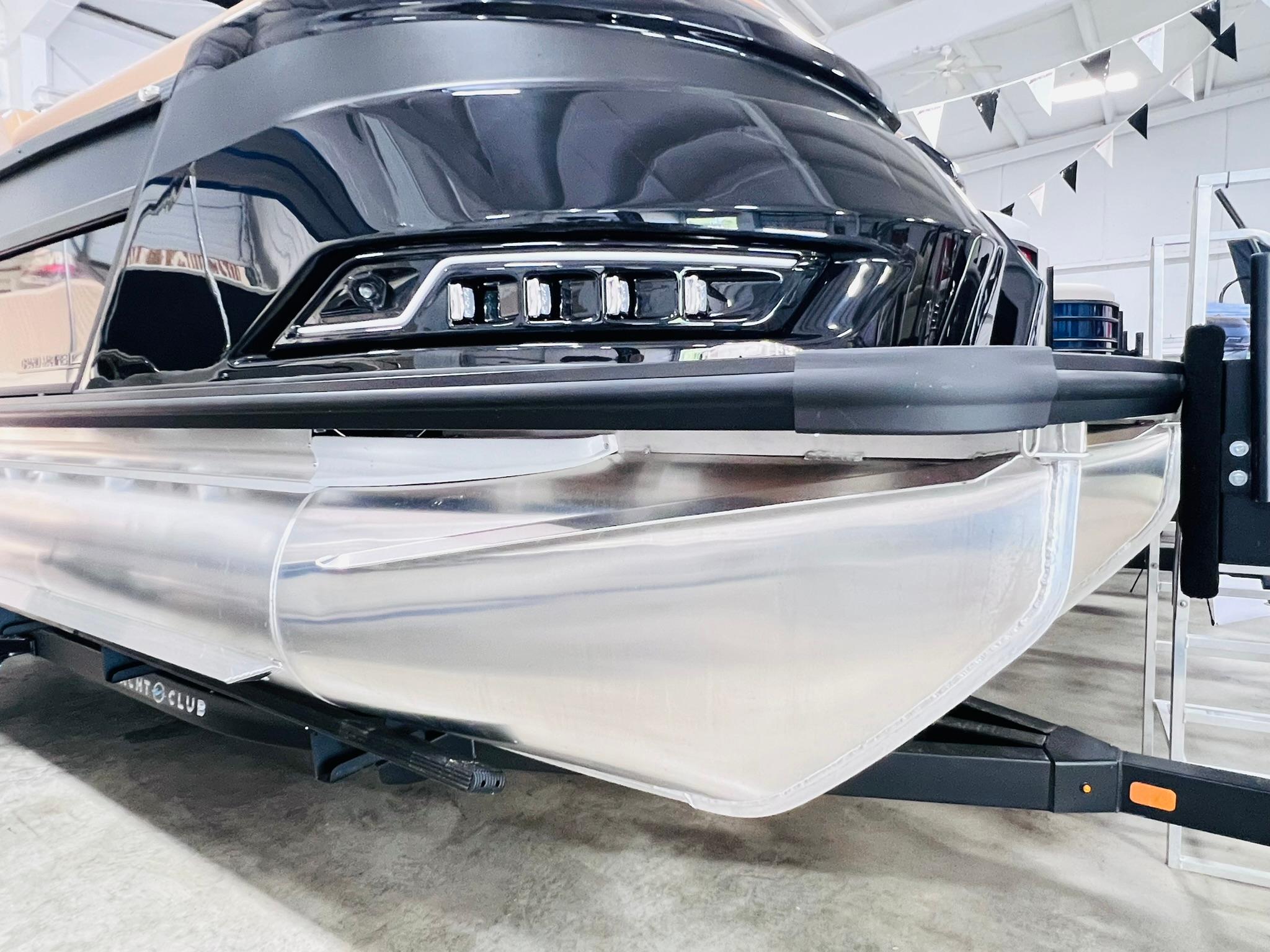2025 Harris Grand Mariner 230 pontoon boat, sleek design, showcased indoors.