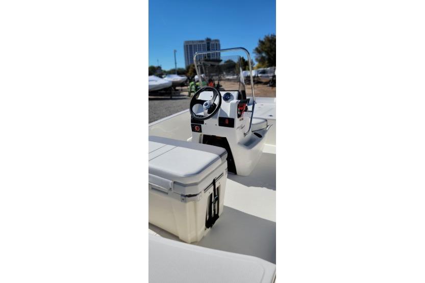2026 Mako Pro Skiff 17 CC boat interior with steering console and seating.