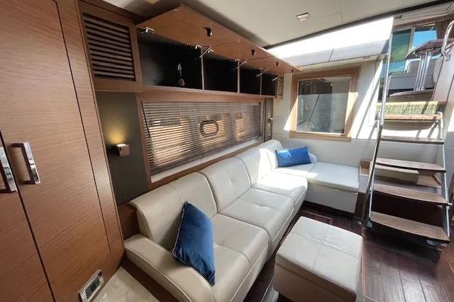 Luxurious interior of 2016 Sea Ray Sundancer 510 yacht with modern seating and natural light.