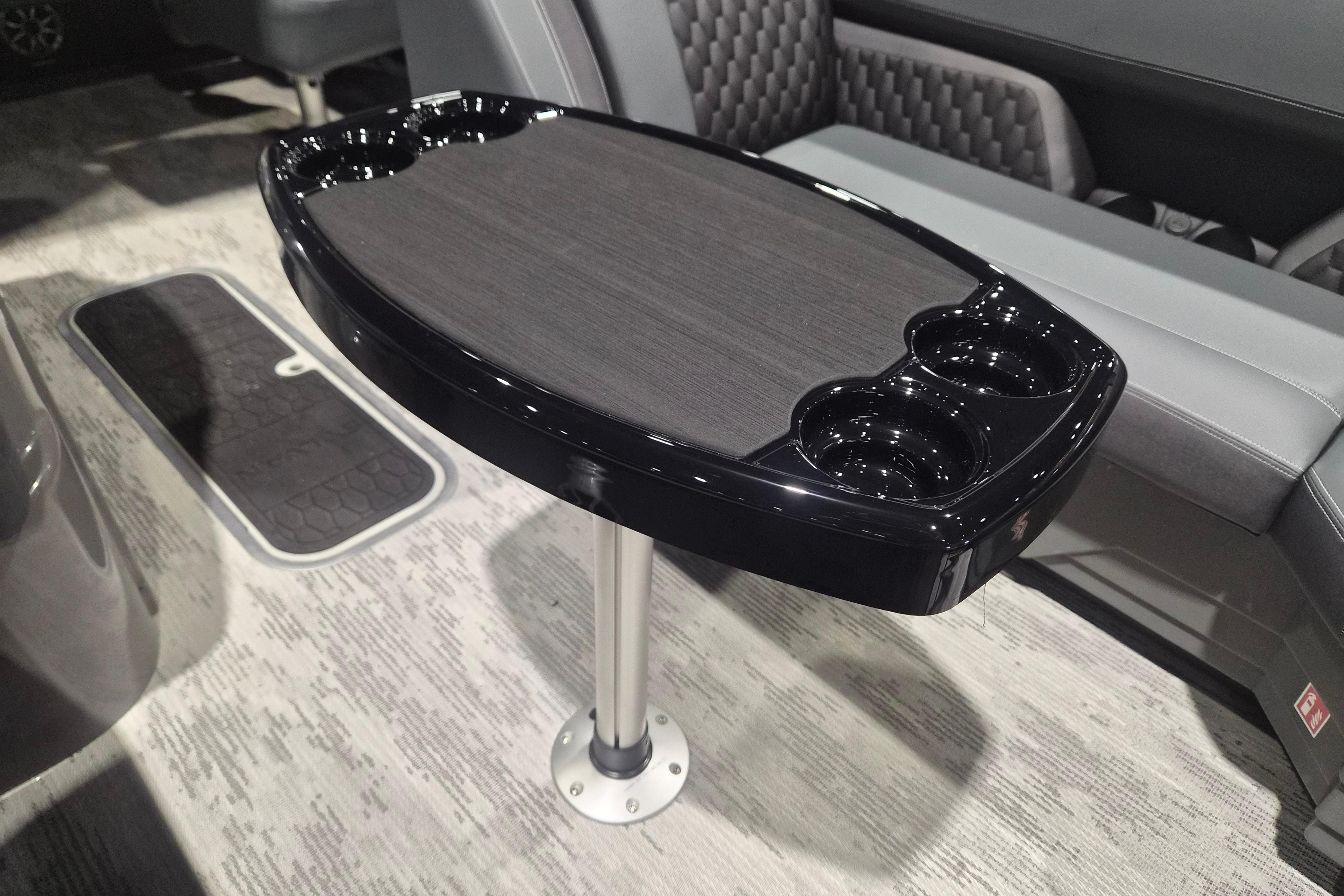 Modern interior of 2026 Sylvan L3 ULZ with sleek table and cup holders.