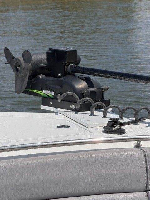 Boston Whaler 330 Outrage 2023 with mounted outboard motor.