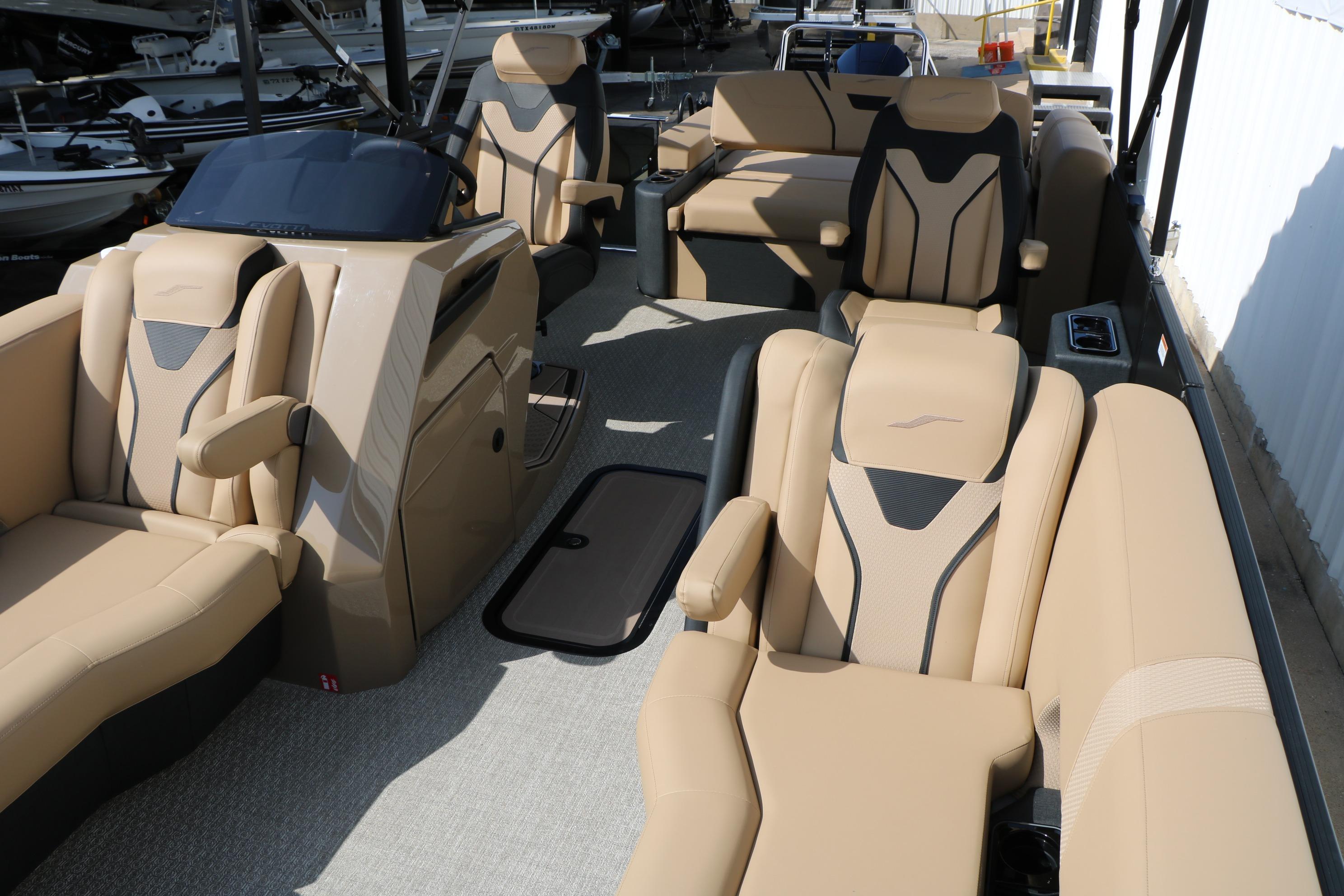 Luxurious interior of 2026 Evotti 723CS boat with beige seating and modern design.