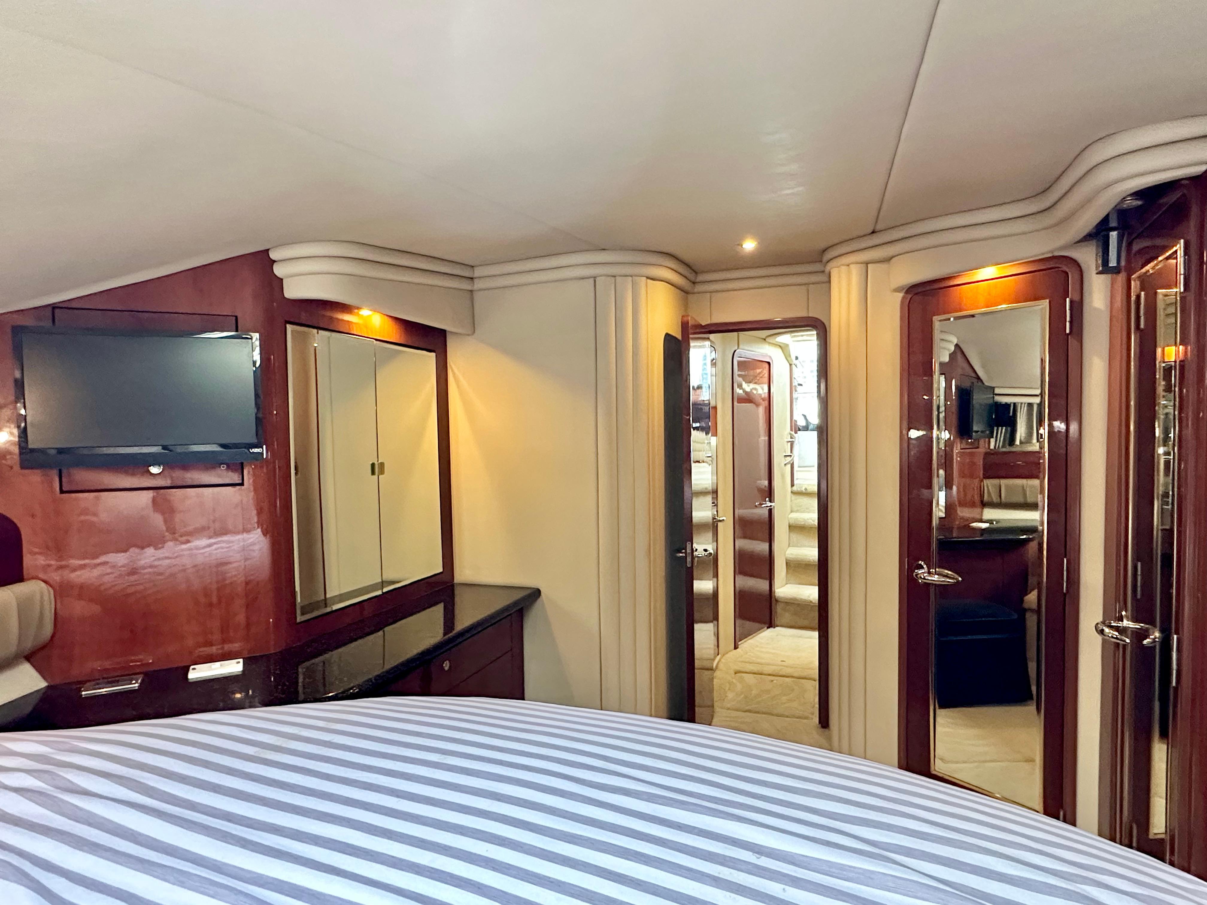 Luxurious interior of 2002 Sea Ray 560 Sedan Bridge yacht with elegant wood finishes.