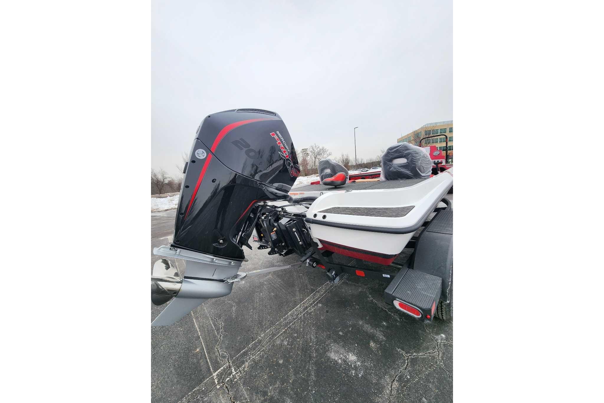 2026 Nitro Z19 XL Pro boat with powerful outboard motor, parked on a snowy day.