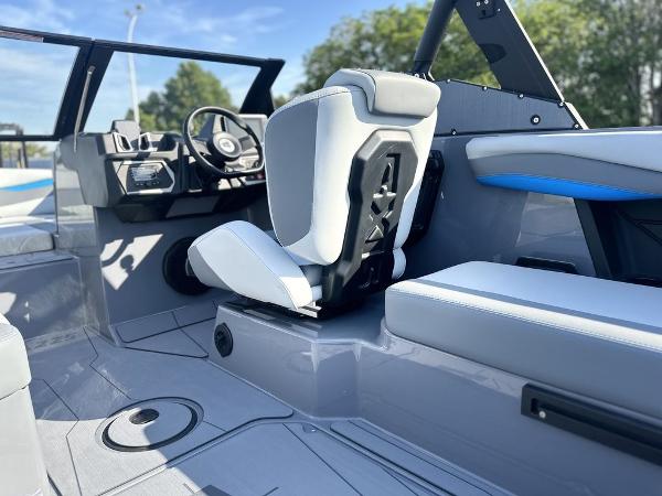 2025 Axis A225 boat interior with modern seating and steering wheel.