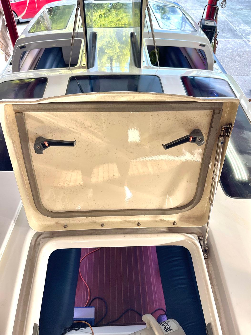 2008 Goetz Custom Boats 33' Limo Tender interior with open hatch and seating area.