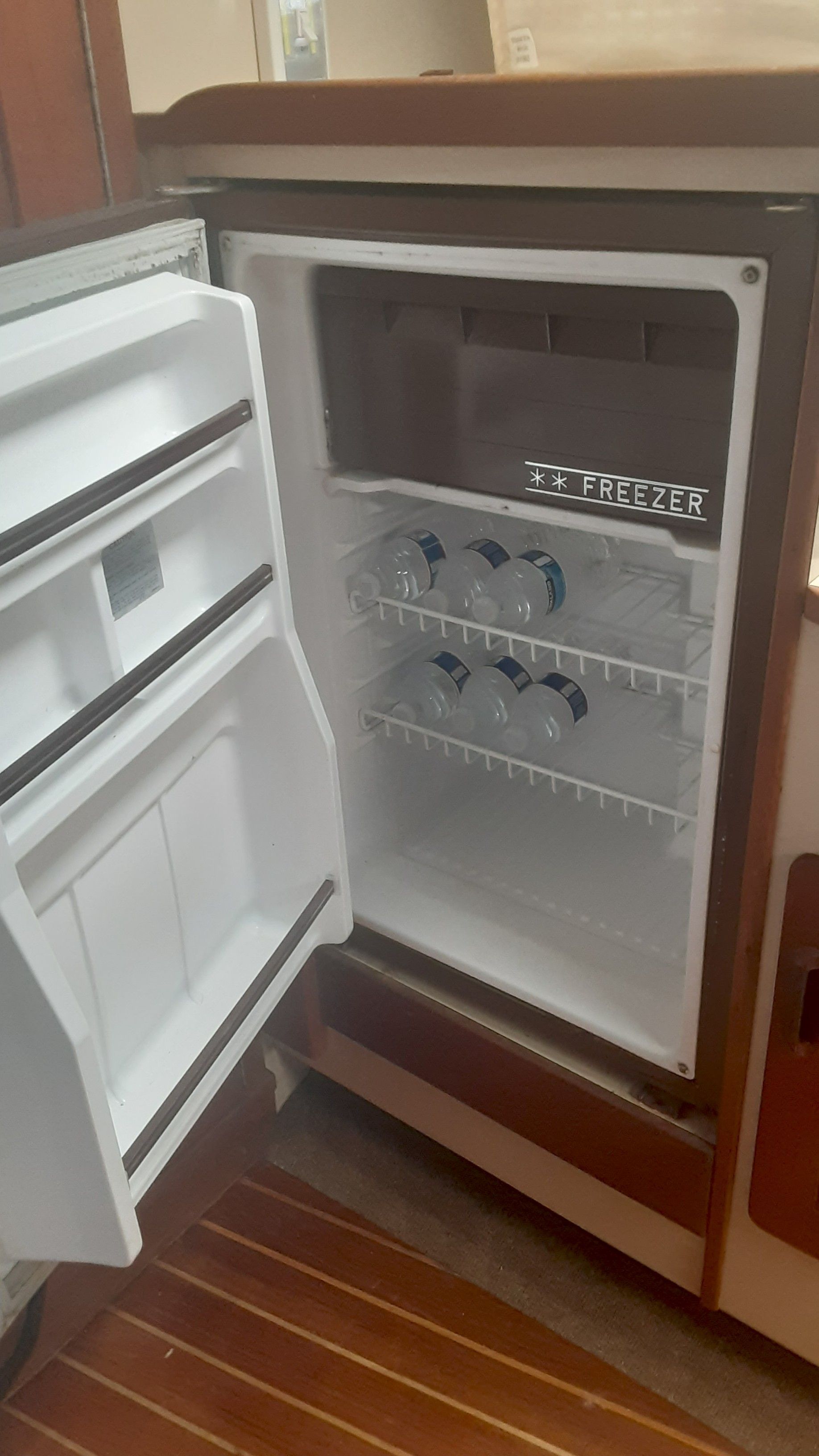 Open fridge on a 1985 Tiara Yachts 3100 Open.
