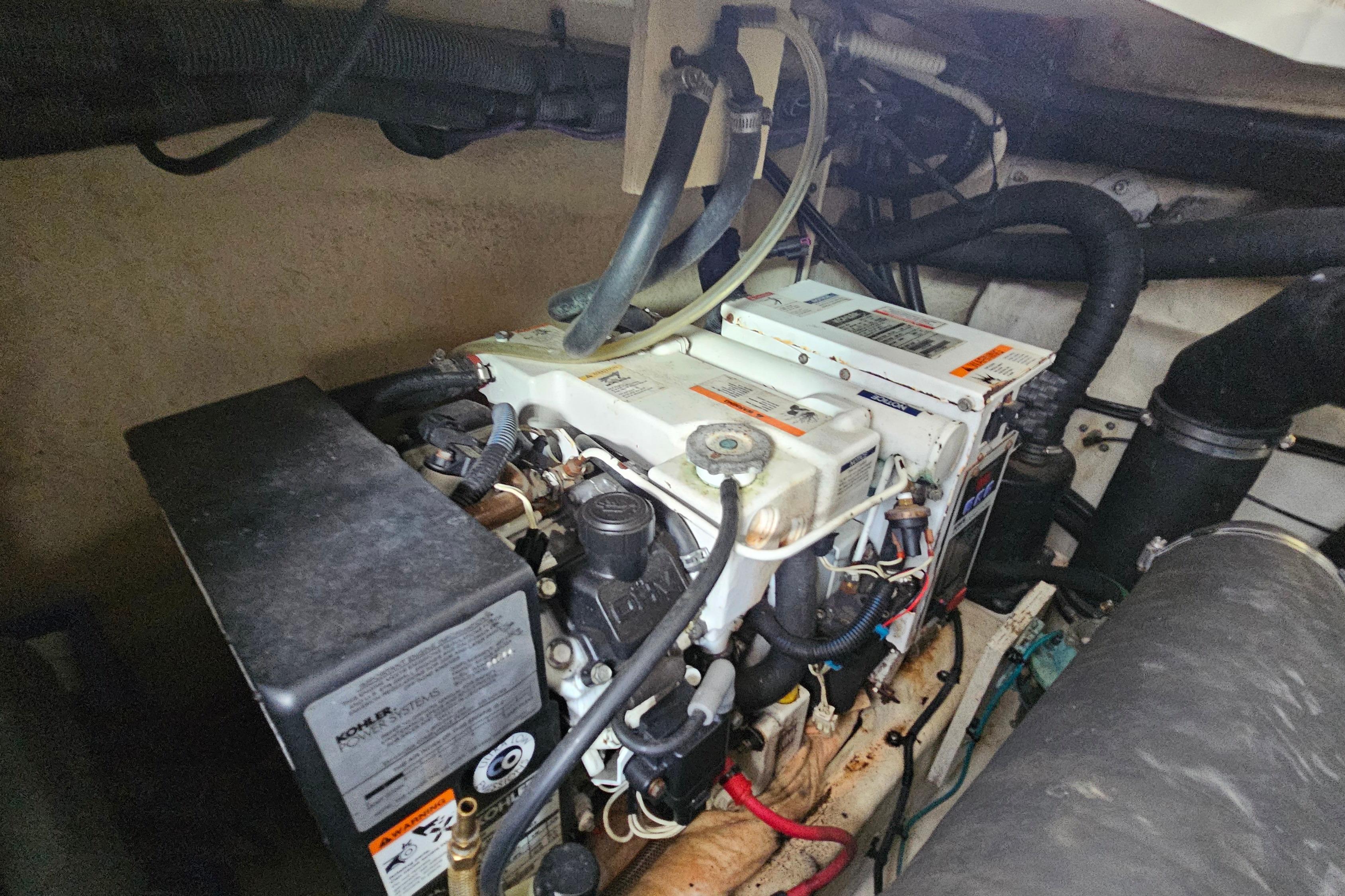 Engine compartment of a 2008 Sea Ray Sundancer 350 boat, showcasing mechanical components.