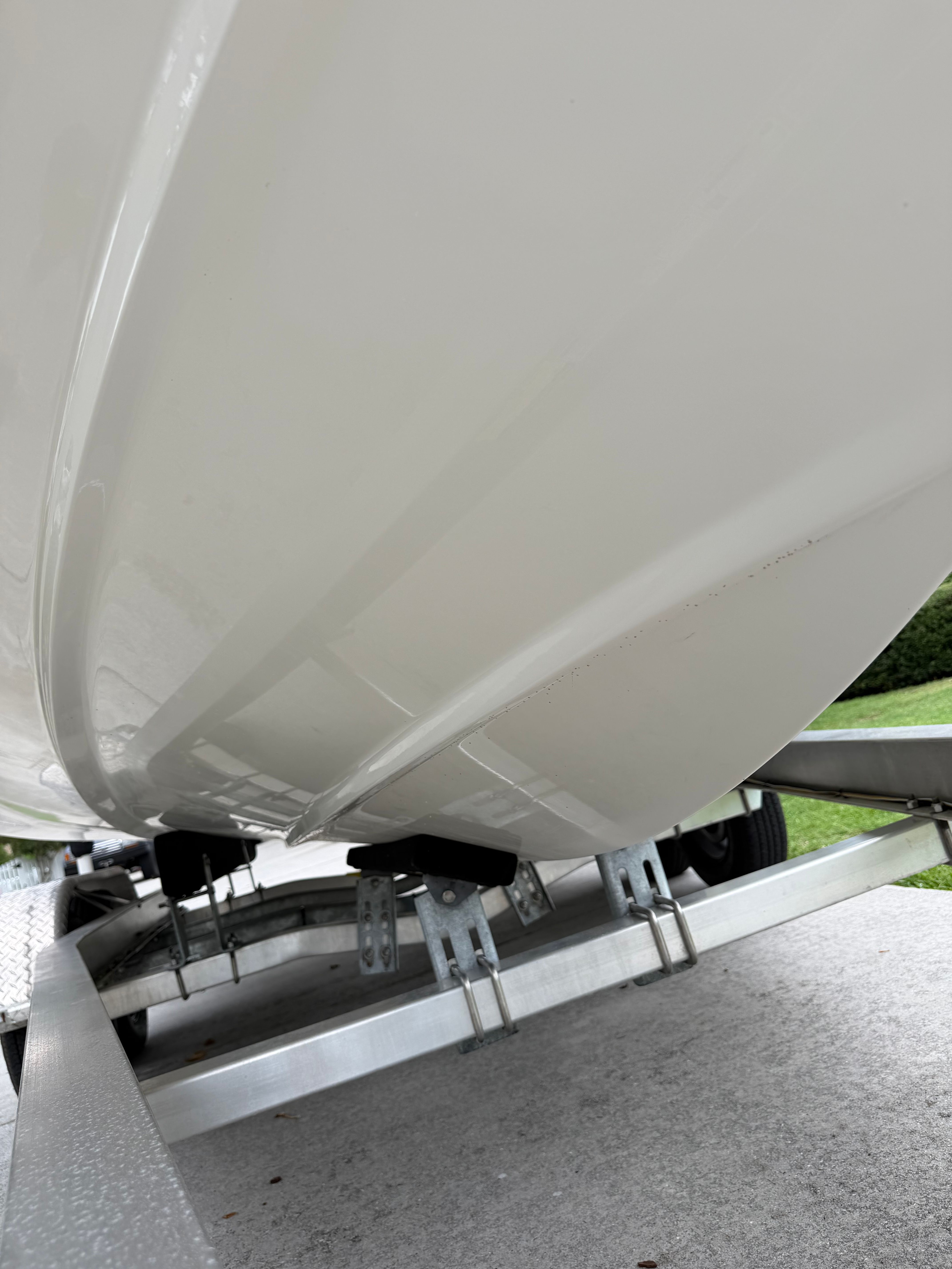 Close-up of a Boston Whaler 220 Dauntless hull on a trailer.